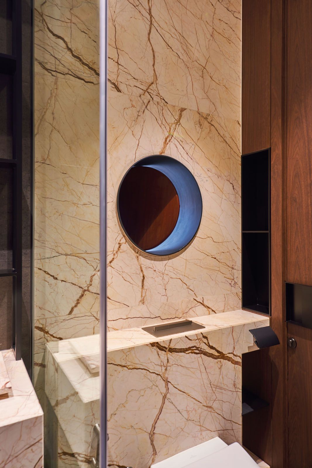 This powder room features a porthole window