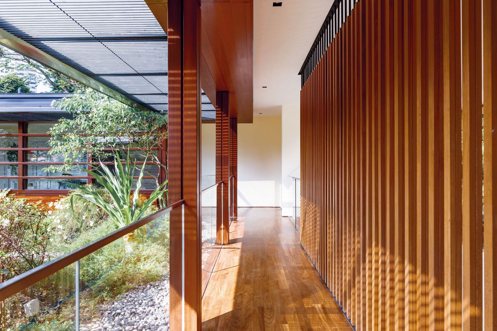 The wooden screen shields the room from the heat of the sun