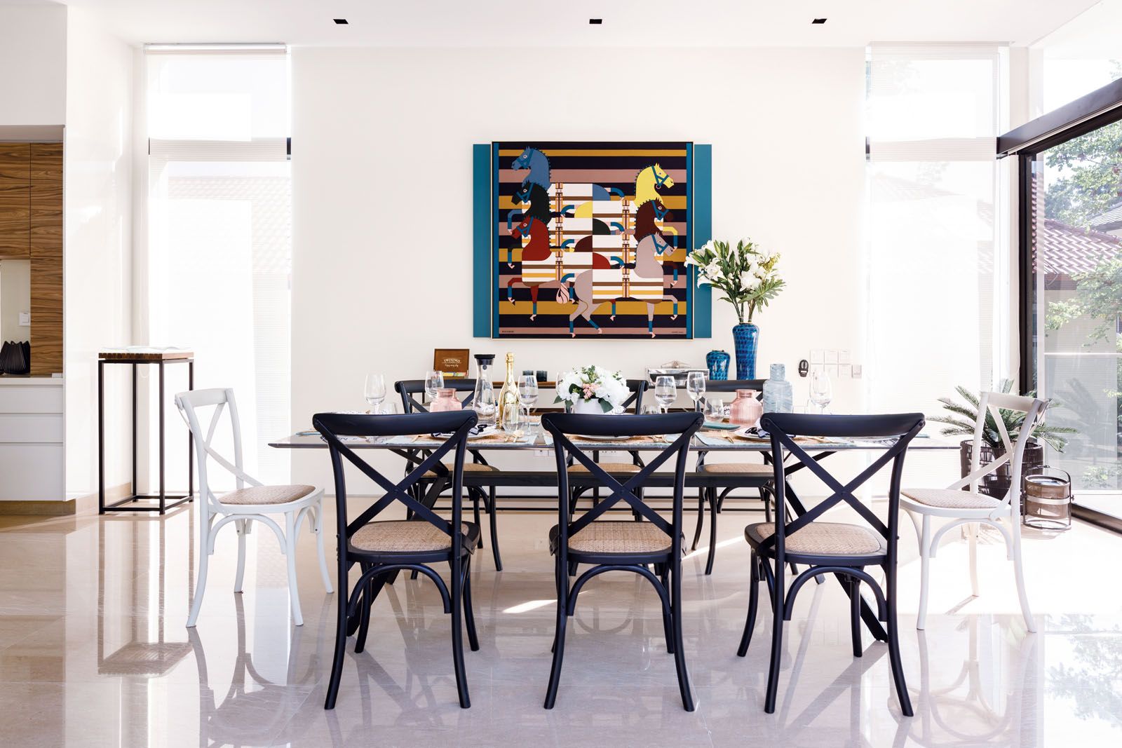 The design firm framed a selection of Hermès scarves to turn these stylish accessories into artworks displayed at various areas of this house