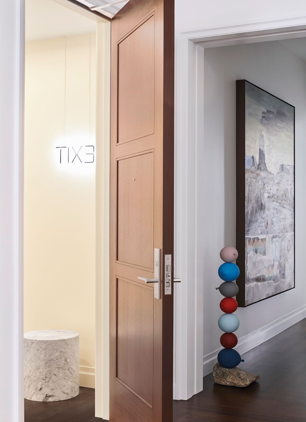 The exit sign displayed above a Kelly Wearstler side table is another playful gesture