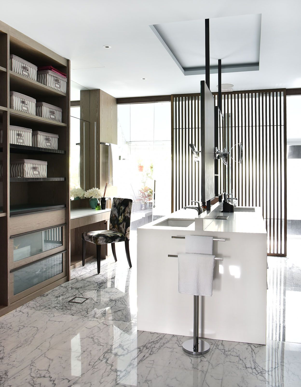 The master bathroom features a spacious his-and-hers vanity area