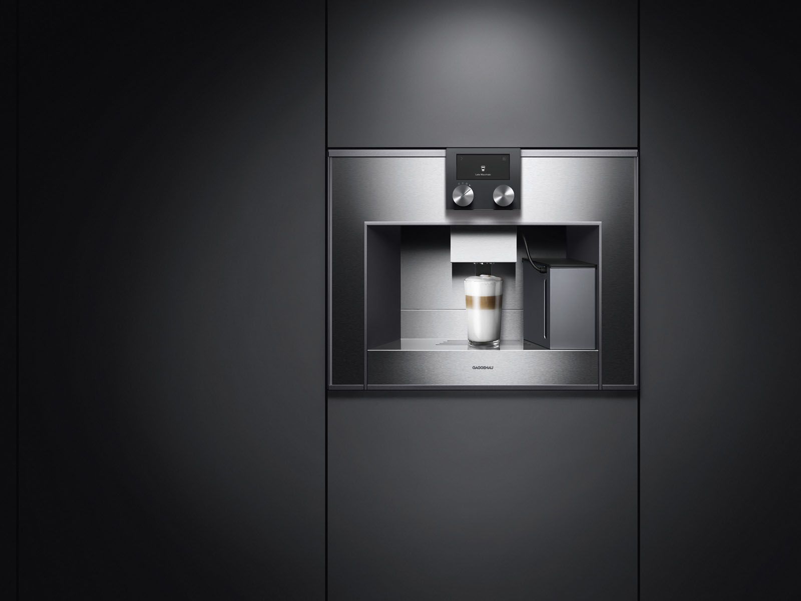 The fully automatic espresso machine from Gaggenau's 400 collection features a handle-less automatic door and a continuous flow heater that maintains a constant brewing temperature