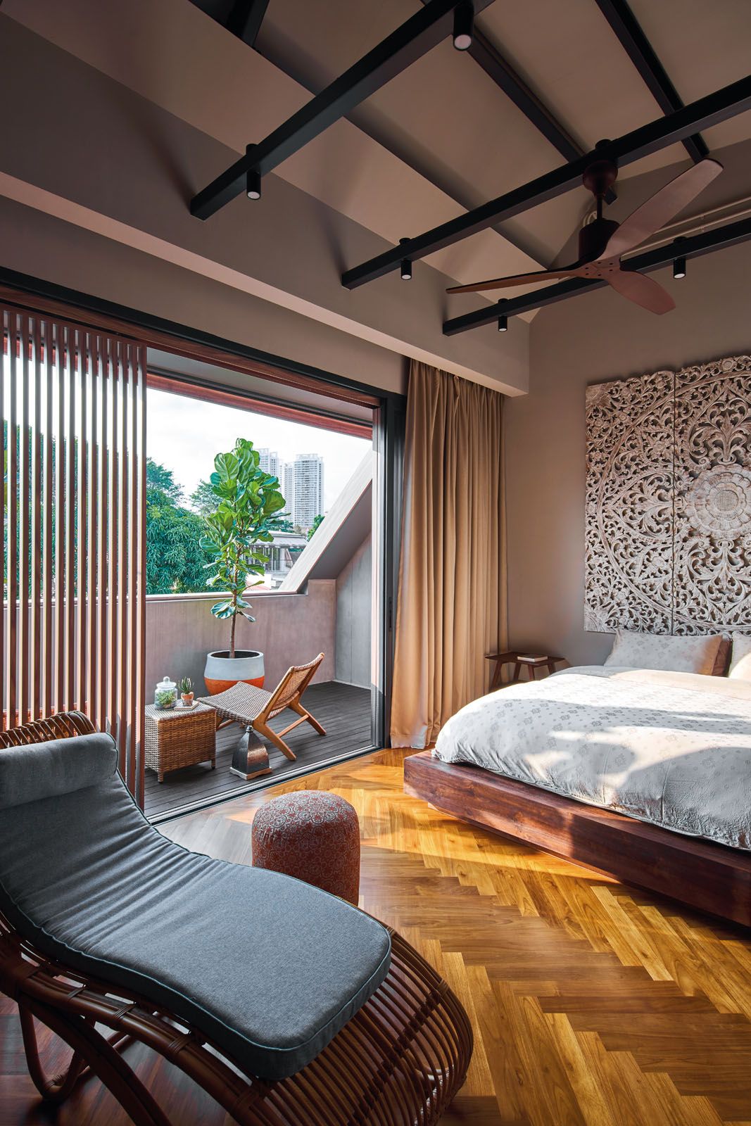 The headboard with an ornate lotus design is the centrepiece of the master suite