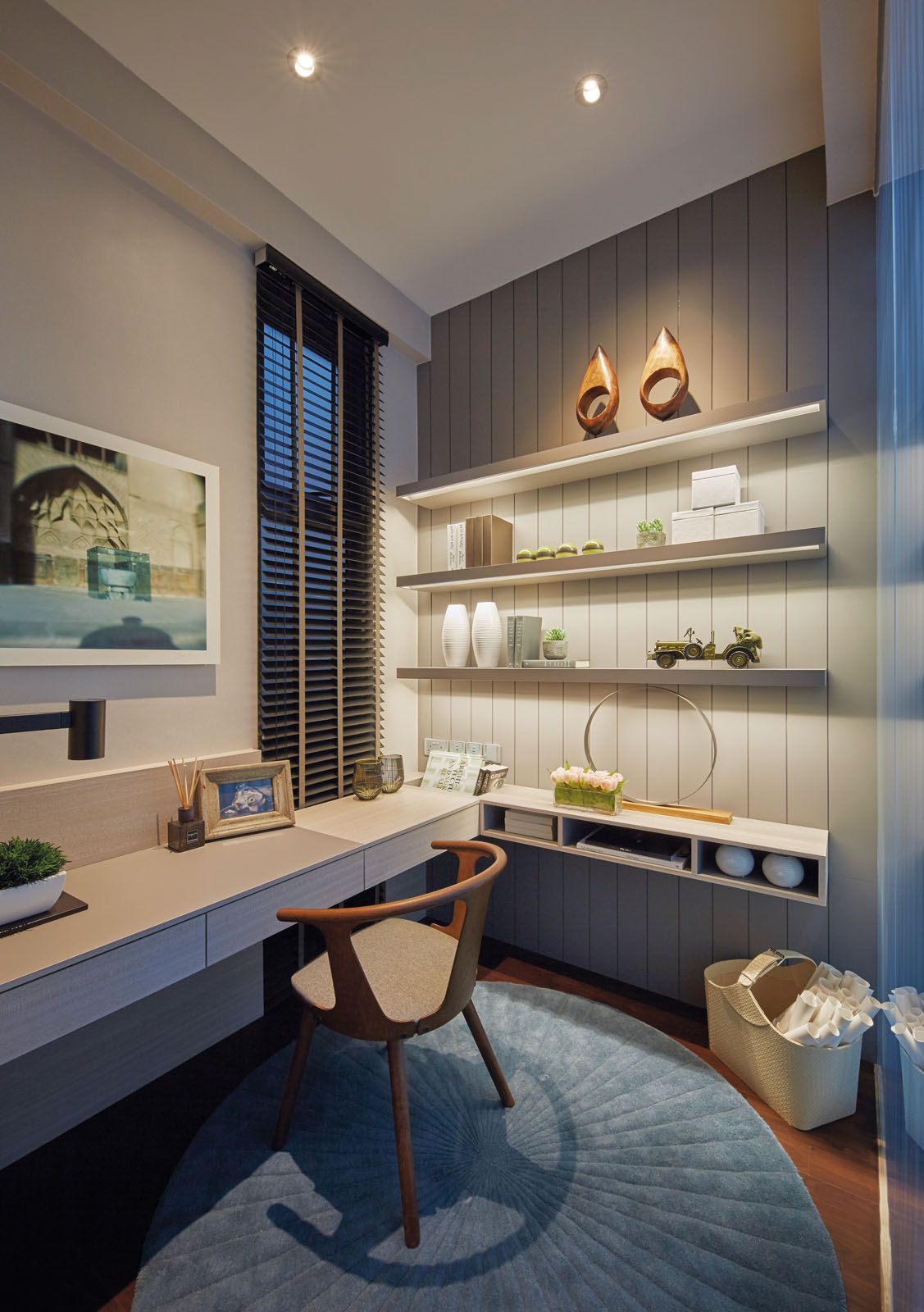 The serene blue palette creates a tranquil atmosphere in the study