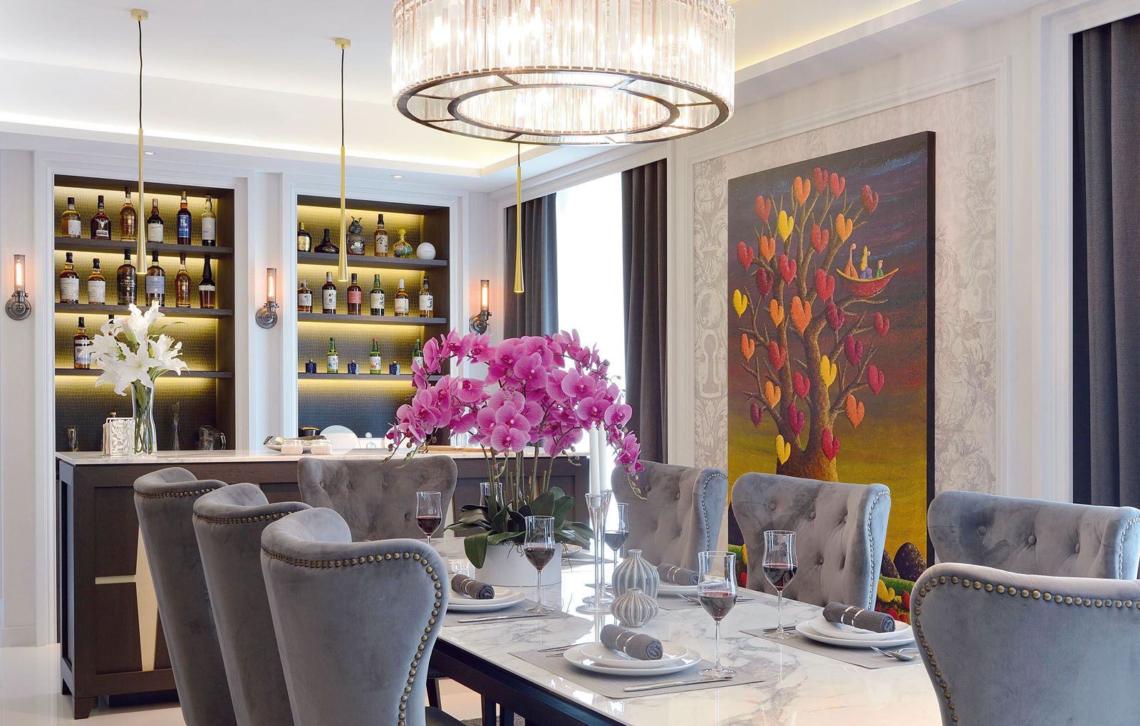 A painting by Coplu creates visual interest in the dining area