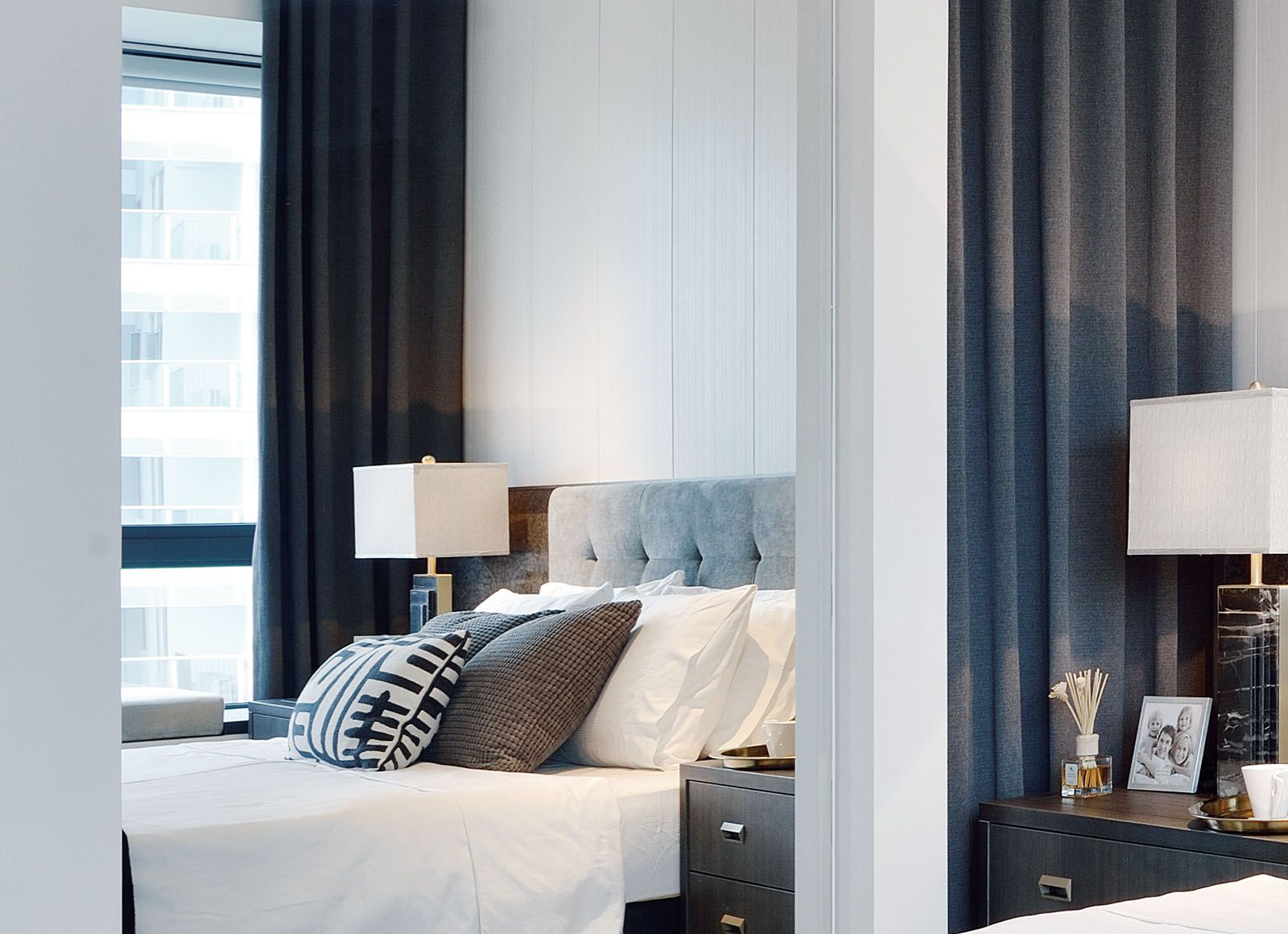 Off-white wall panels complement the modern-classic look of the master bedroom