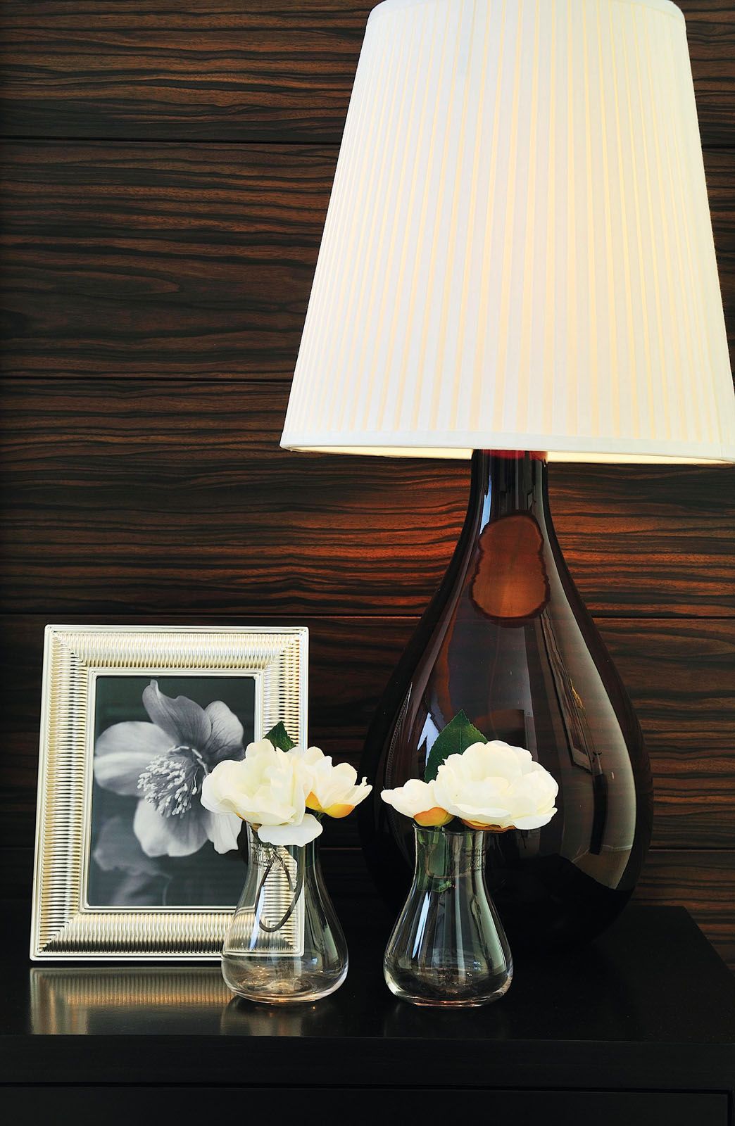 The use of dark wood contributes to the apartment’s handsome interior