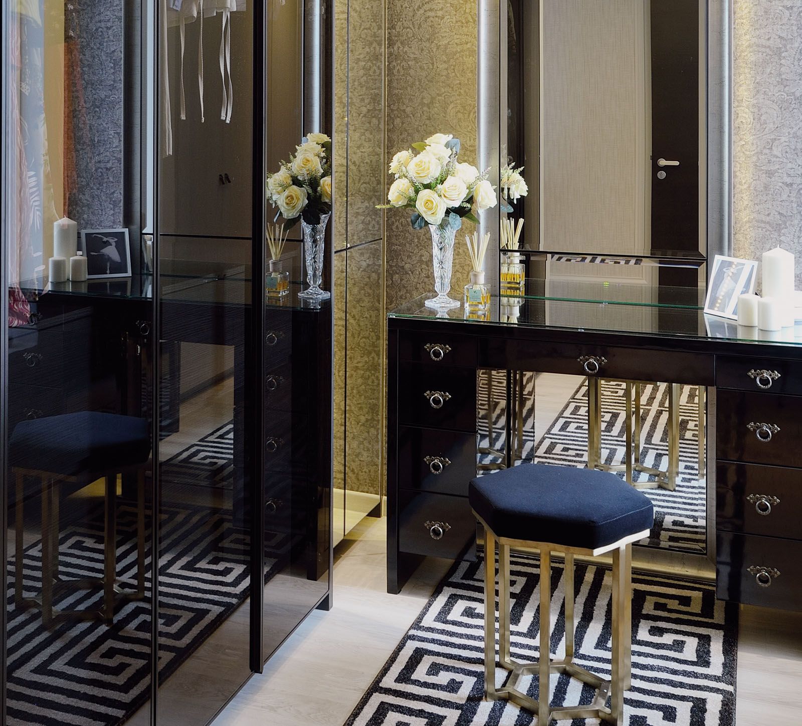 The geometric rug livens up the wardrobe area