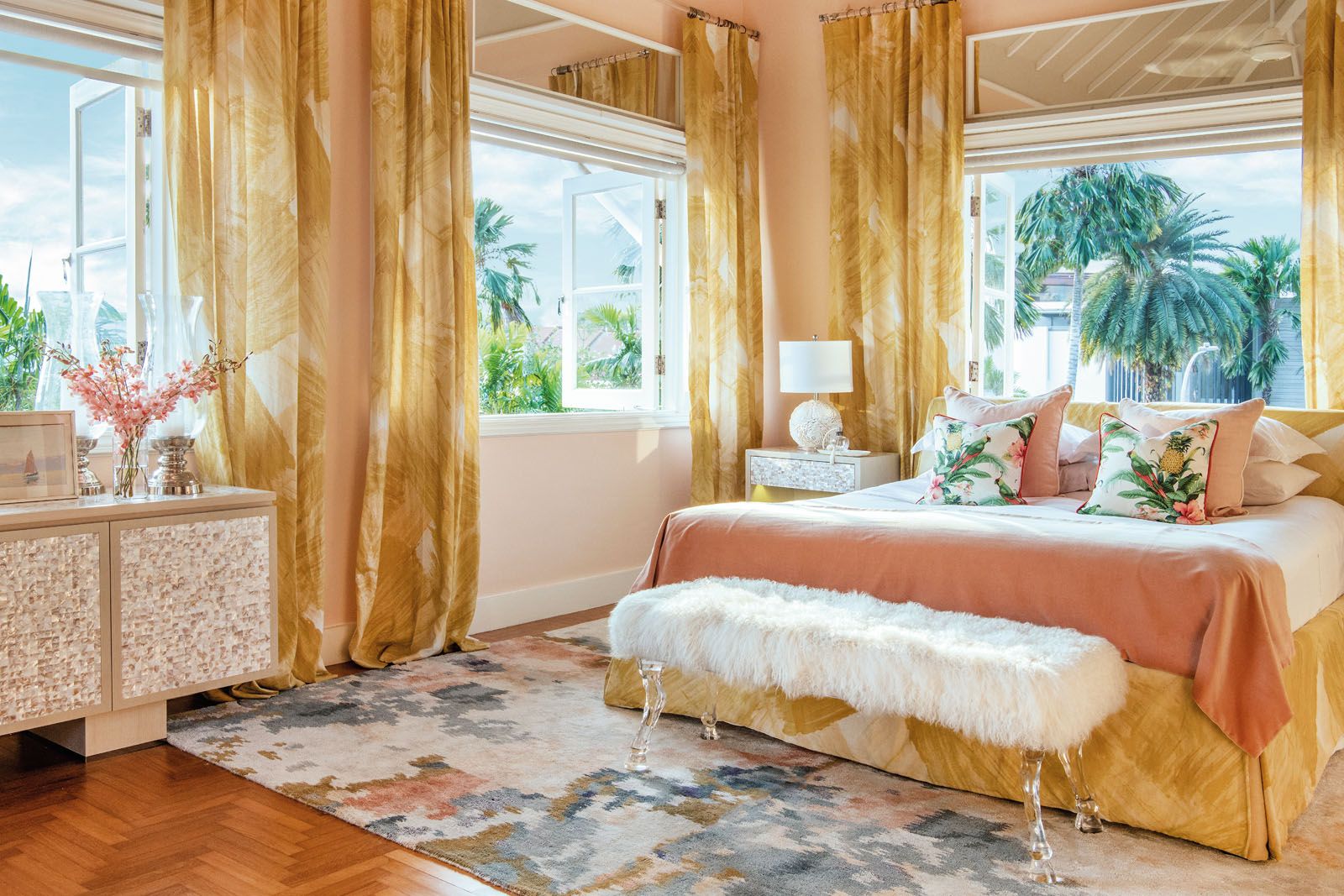 Yellow accents liven up the pastel palette of the study and bed area in the master suite