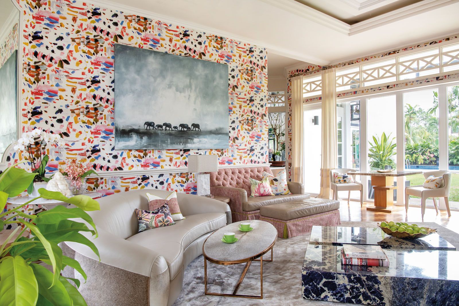 The Pierre Frey wallpaper in the TV room adds an artistic flourish to the space