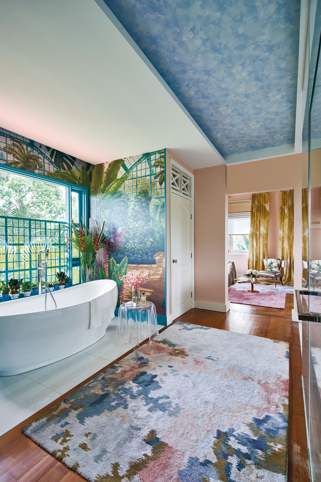 Palm motifs on the bathroom window complement the existing wallpaper