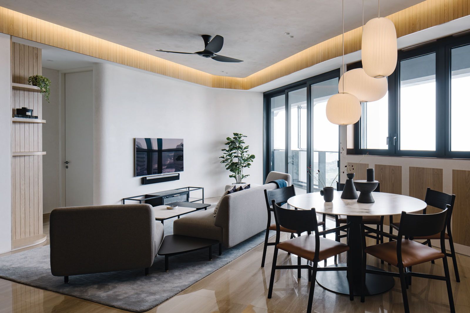The awkward plan provided the perfect opportunity for Tan to design bespoke furniture, which includes the dining table, sofa, coffee table and TV console
