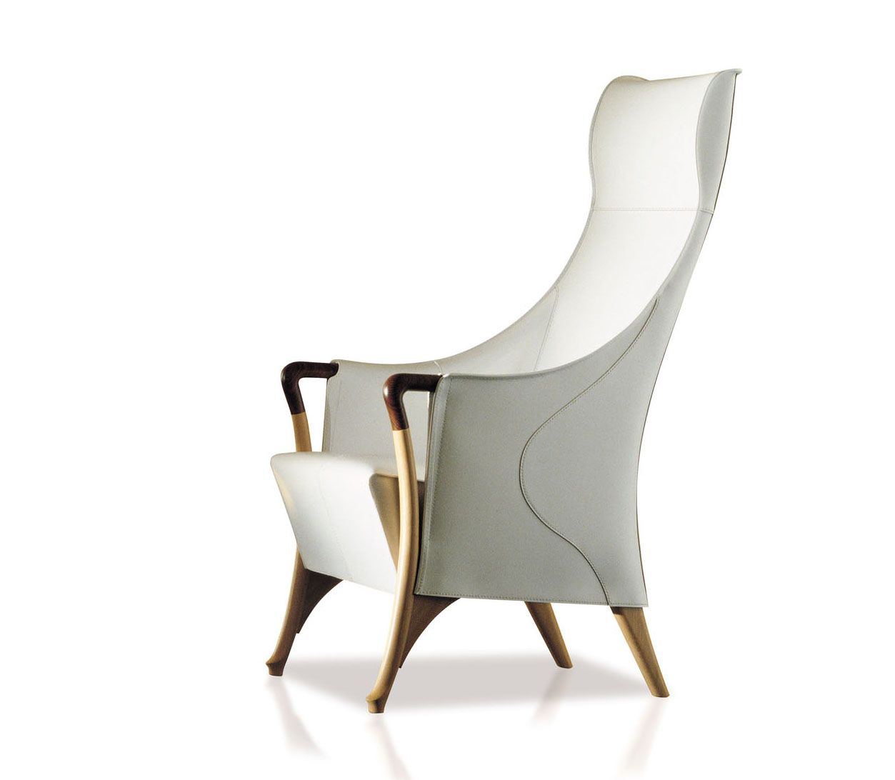 The iconic Progetti armchair from Giorgetti features armrests designed in a style similar to the handle of an antique walking stick