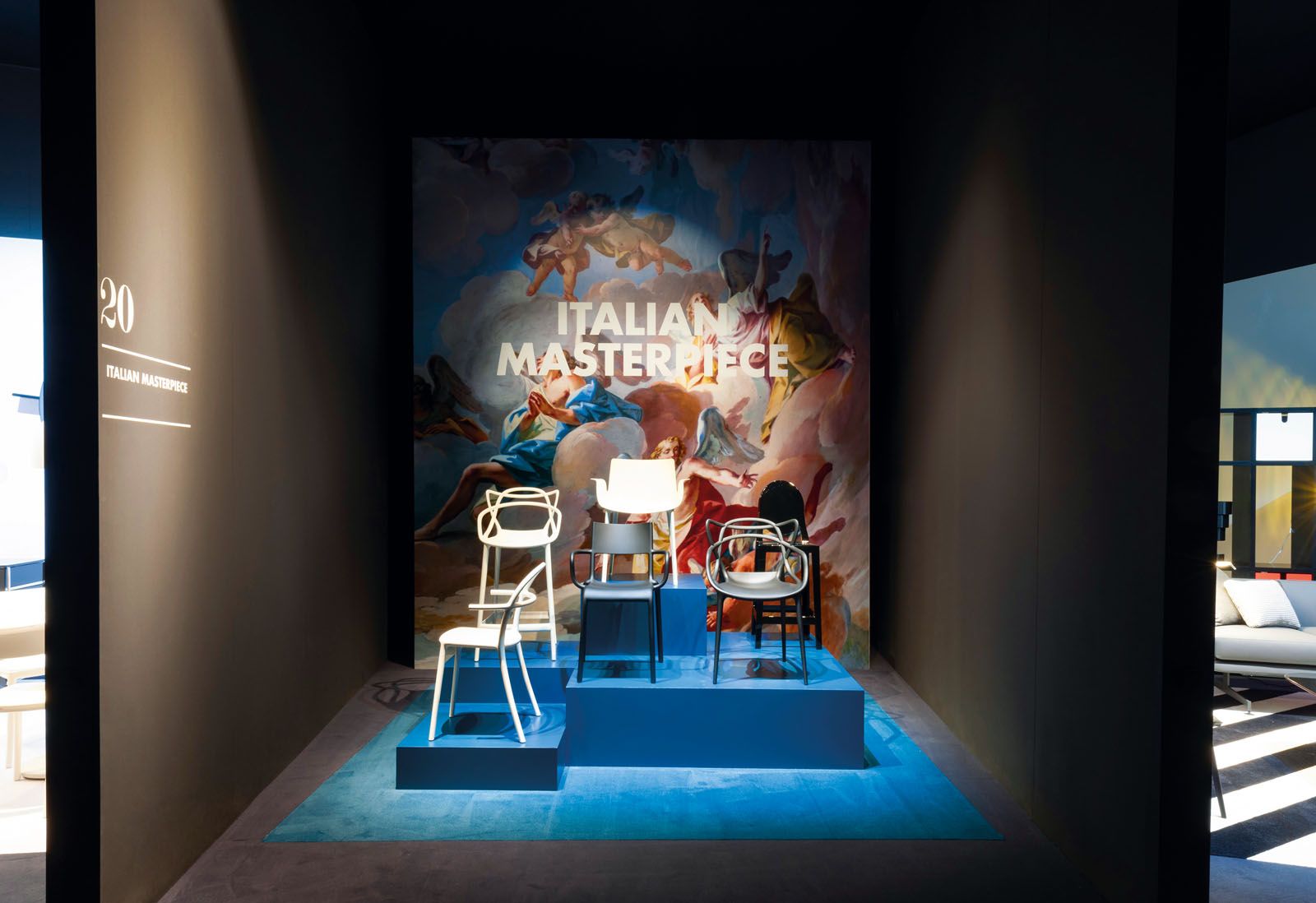 A section displaying some of the iconic chairs by Kartell, shown at the Salone del Mobile fair in Milan