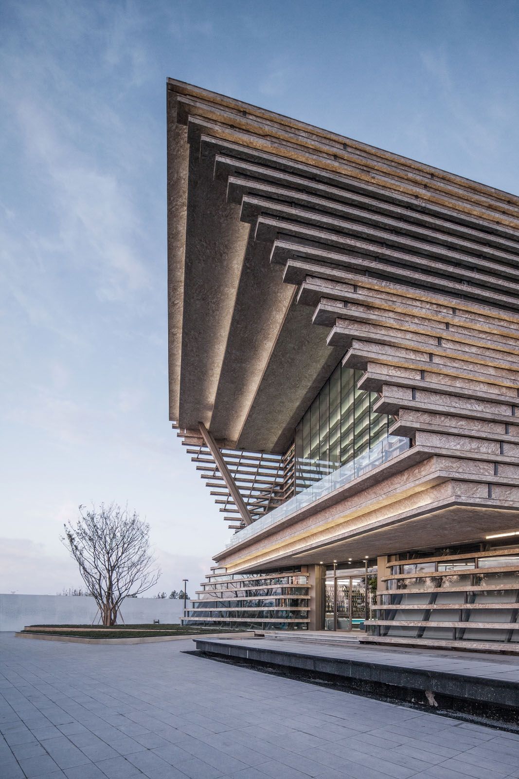 The Spiritual Bay Pavilion in Qingdao elegantly tilts 27 degrees to accord the upper levels spectacular sea views