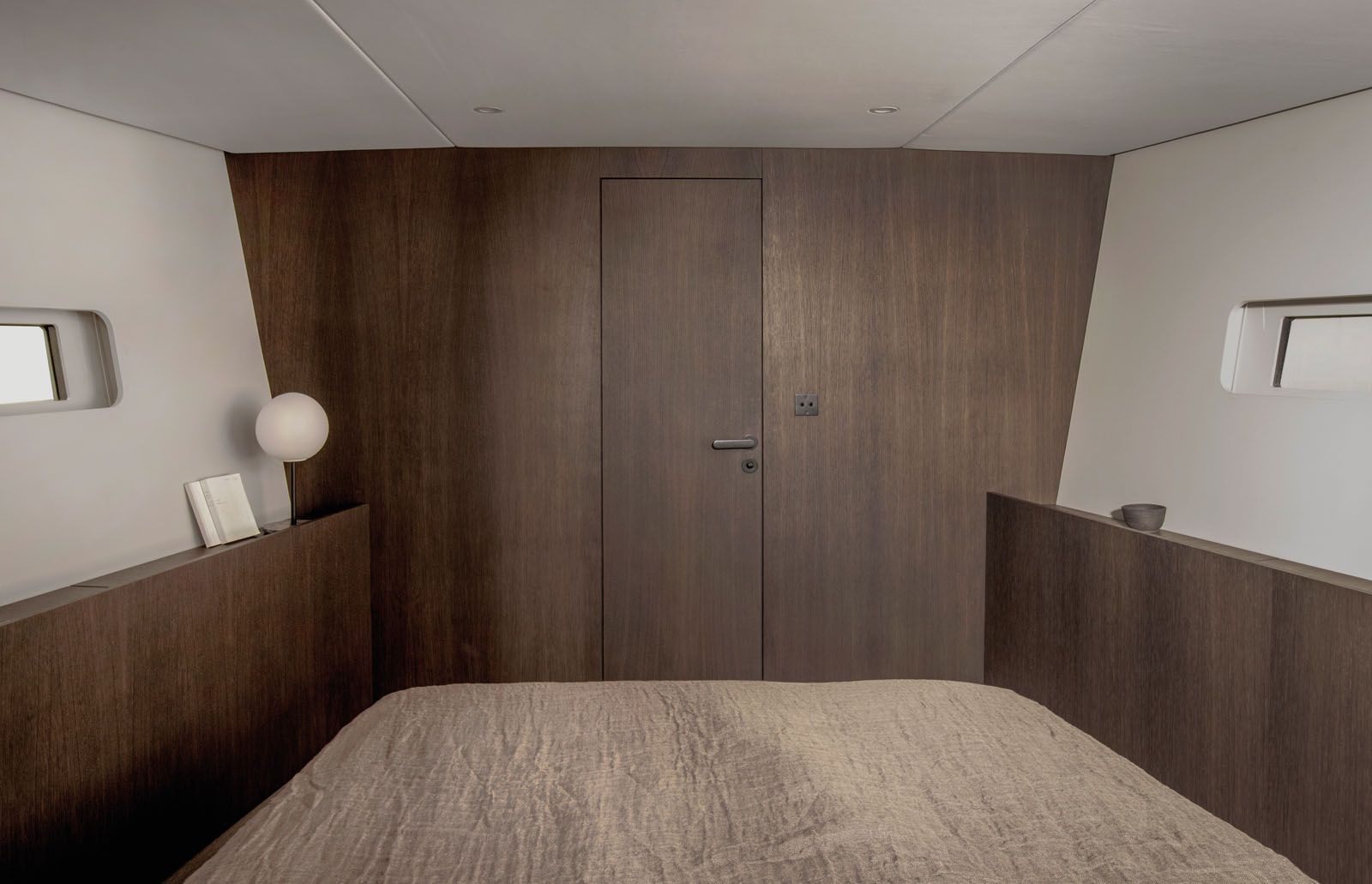The ample use of dark wood and other natural materials creates a cosy ambience on board Bella, the first Y3 model by Y Yachts