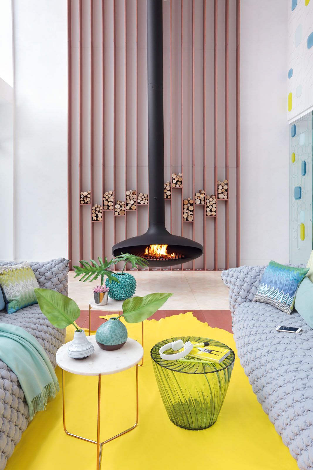 The living room features a pair of Nuvola sofas by Paola Navone for Gervasoni, Missoni cushions and a leather rug