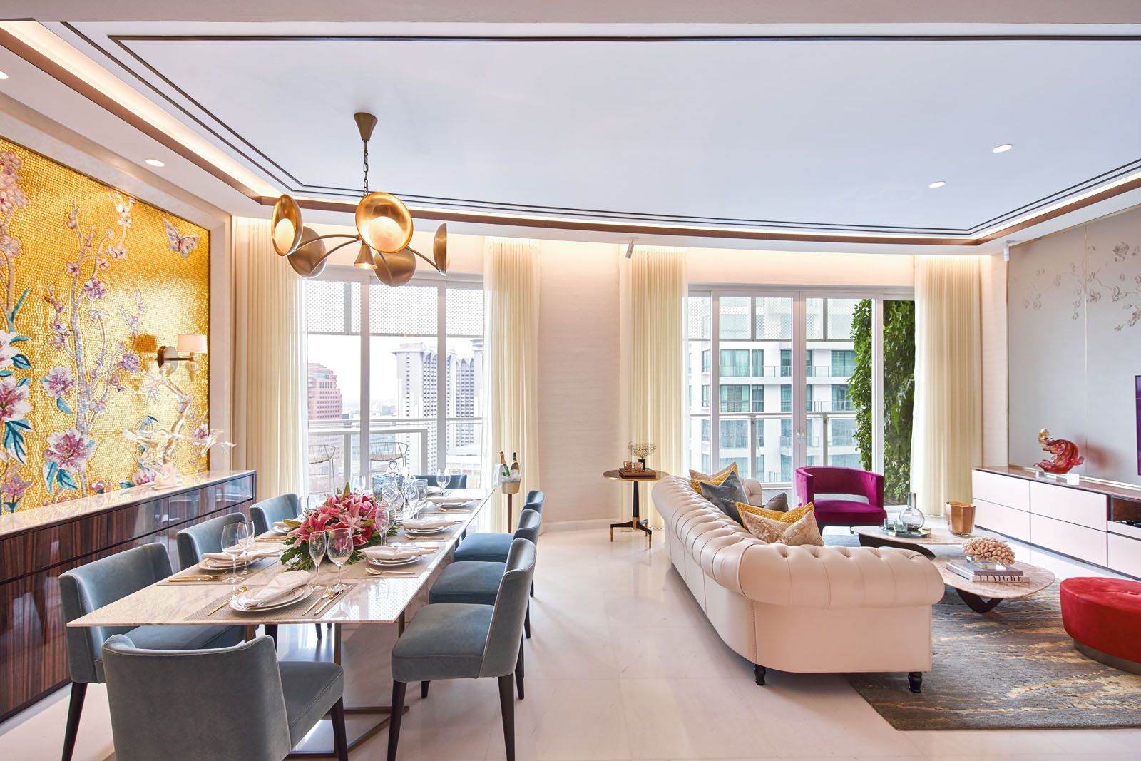 Accent pieces such as the Minotti pouf liven up the neutral palette while incorporating the owners’ preference for gold and red tones