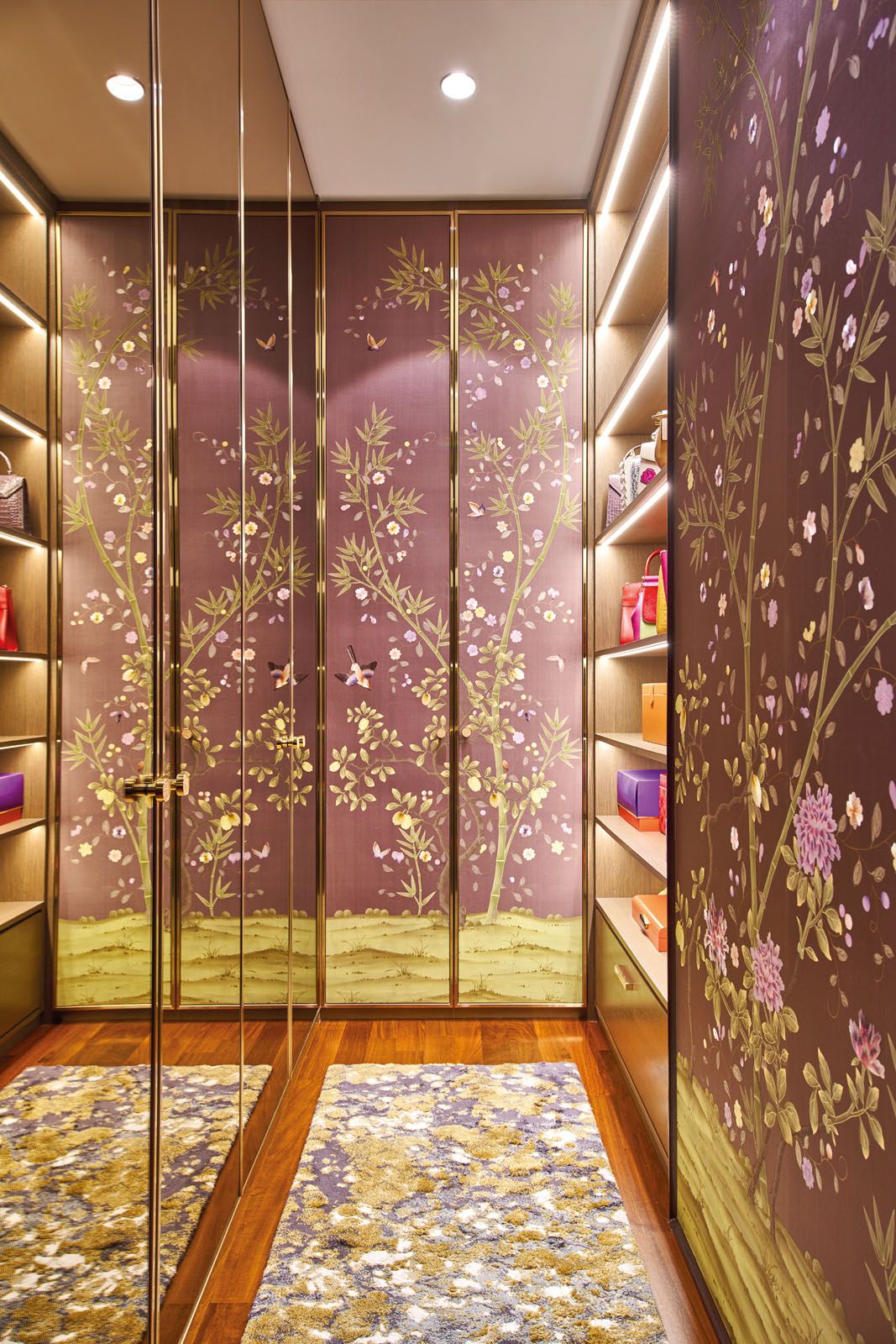 The Fromental wallpaper adds a lively dimension to the wife’s walk-in wardrobe