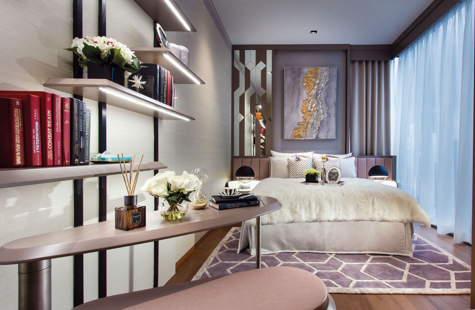 This bedroom features a swivel desk and bench that can be stowed away when unused