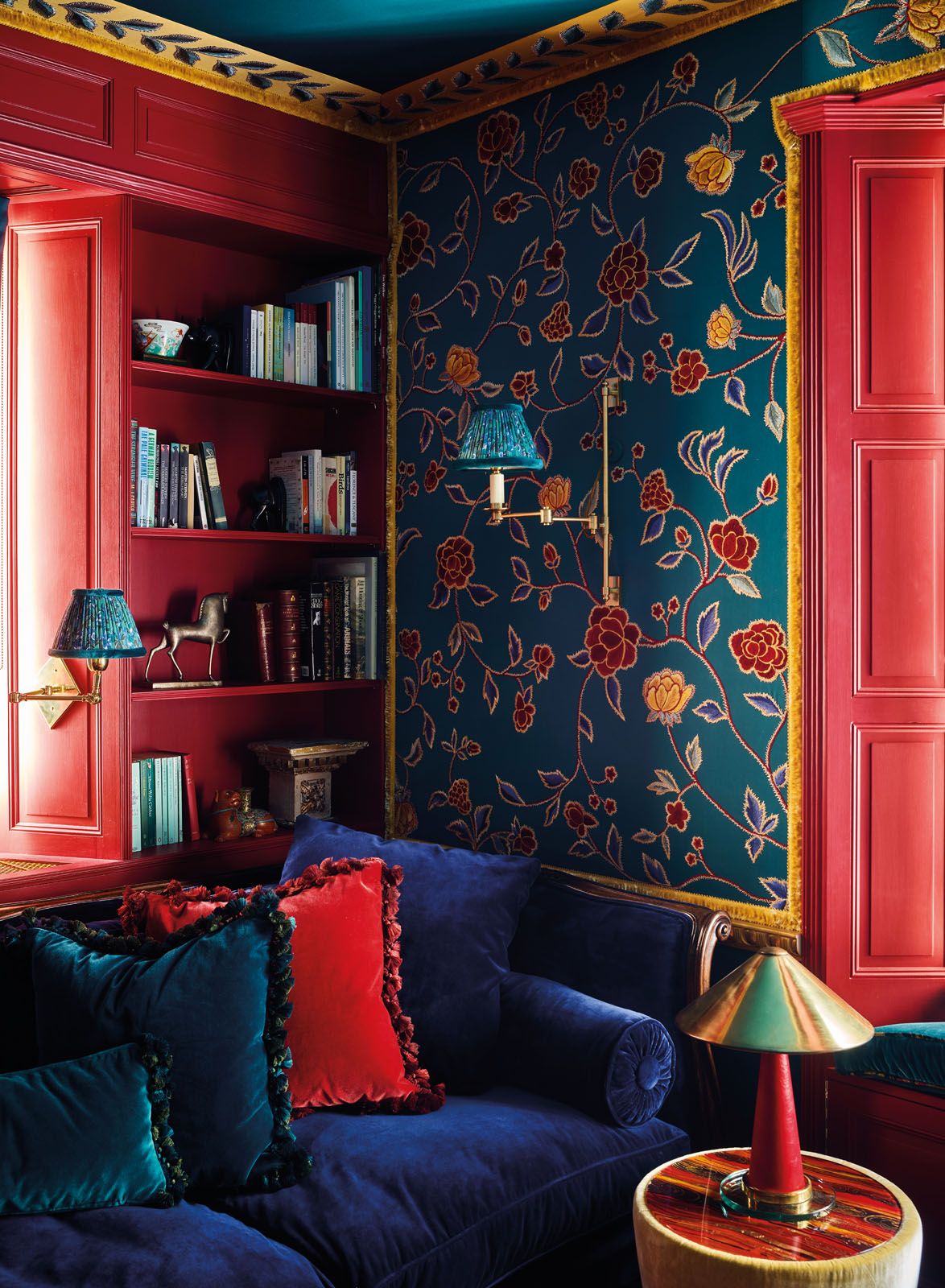 This sitting room features gem tones selected to complement the Flora wallpaper from De Gournay