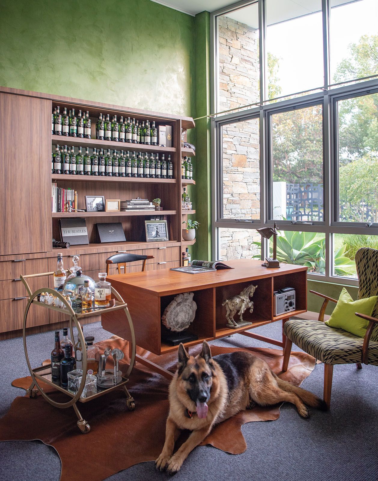 A Venetian plaster finish in olive green was applied to the walls of the study