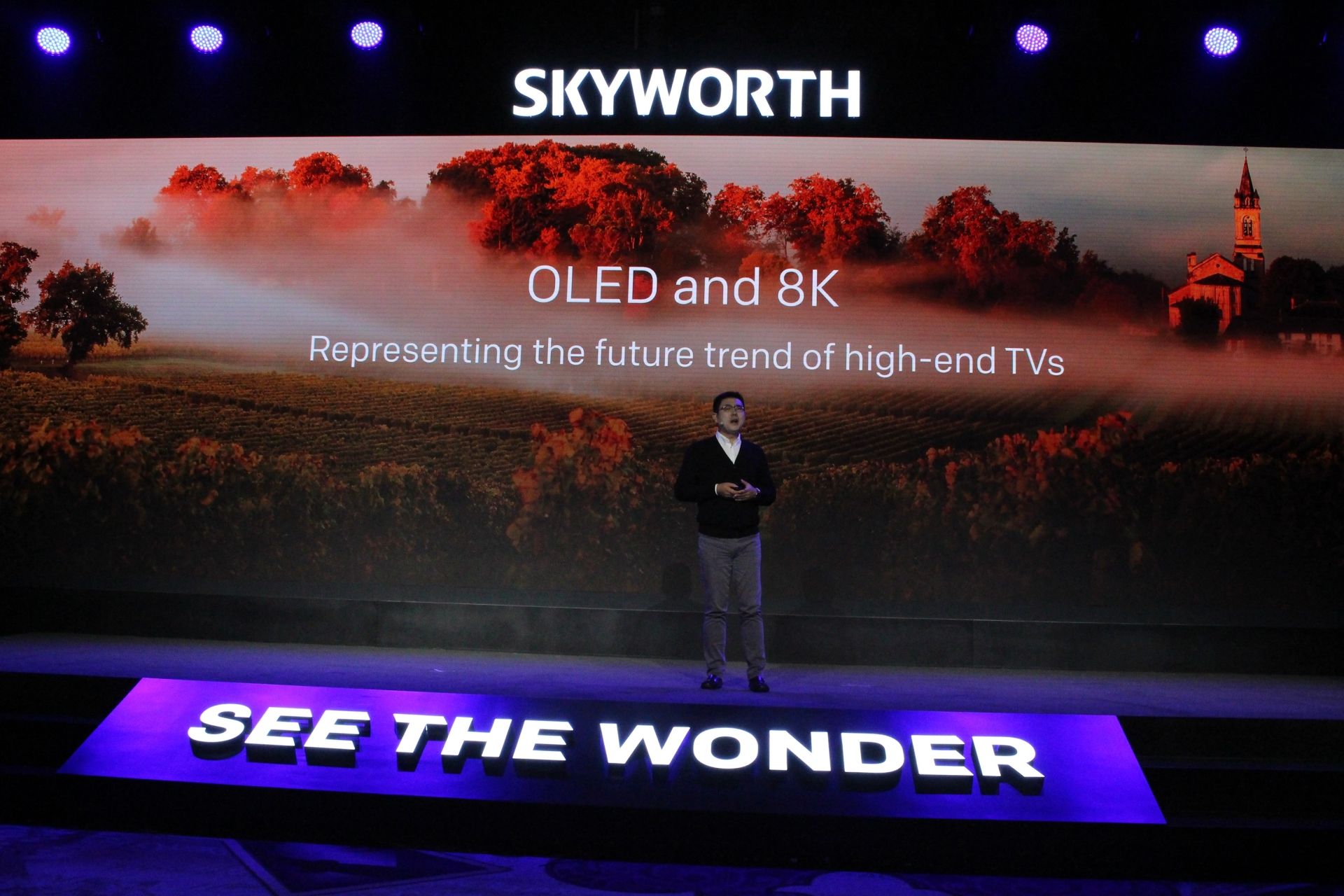 Skyworth chief executive Tony Wang unveils premium 8K TV models at the Consumer Electronics Show during the CES Unveiled event at the 2020 Consumer Electronics Show (CES) in Las Vegas, Nevada, on January 5, 2020. - CES is one of the largest tech shows on the planet, showcasing more than 4,500 exhibiting companies representing the entire consumer technology ecosystem. (Photo by Glenn CHAPMAN / AFP)