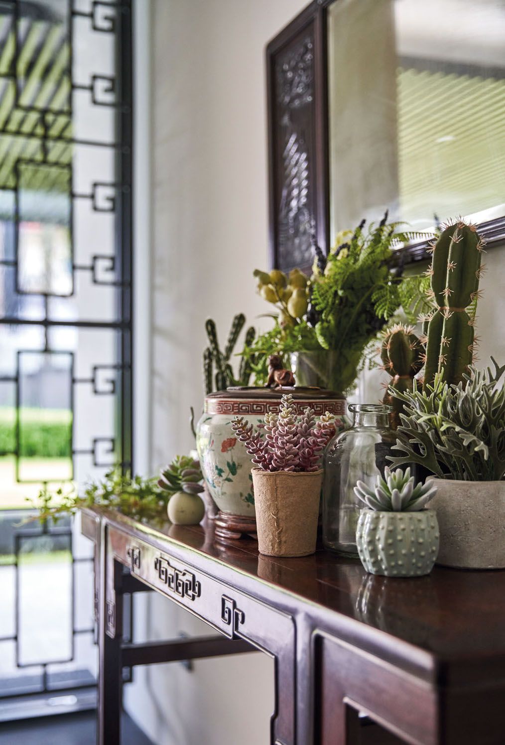 The entryway features an antique console and mirror