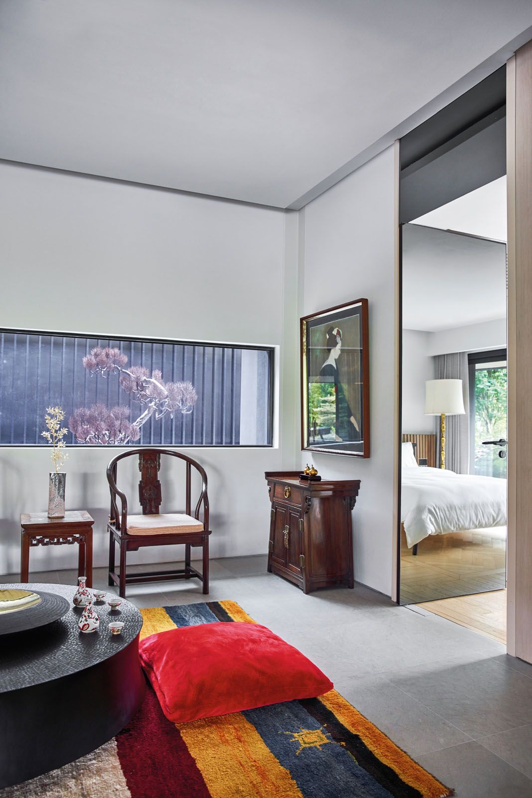 An outdoor sculpture by Mehrdad Tafreshi accentuates this home’s Eastern influences