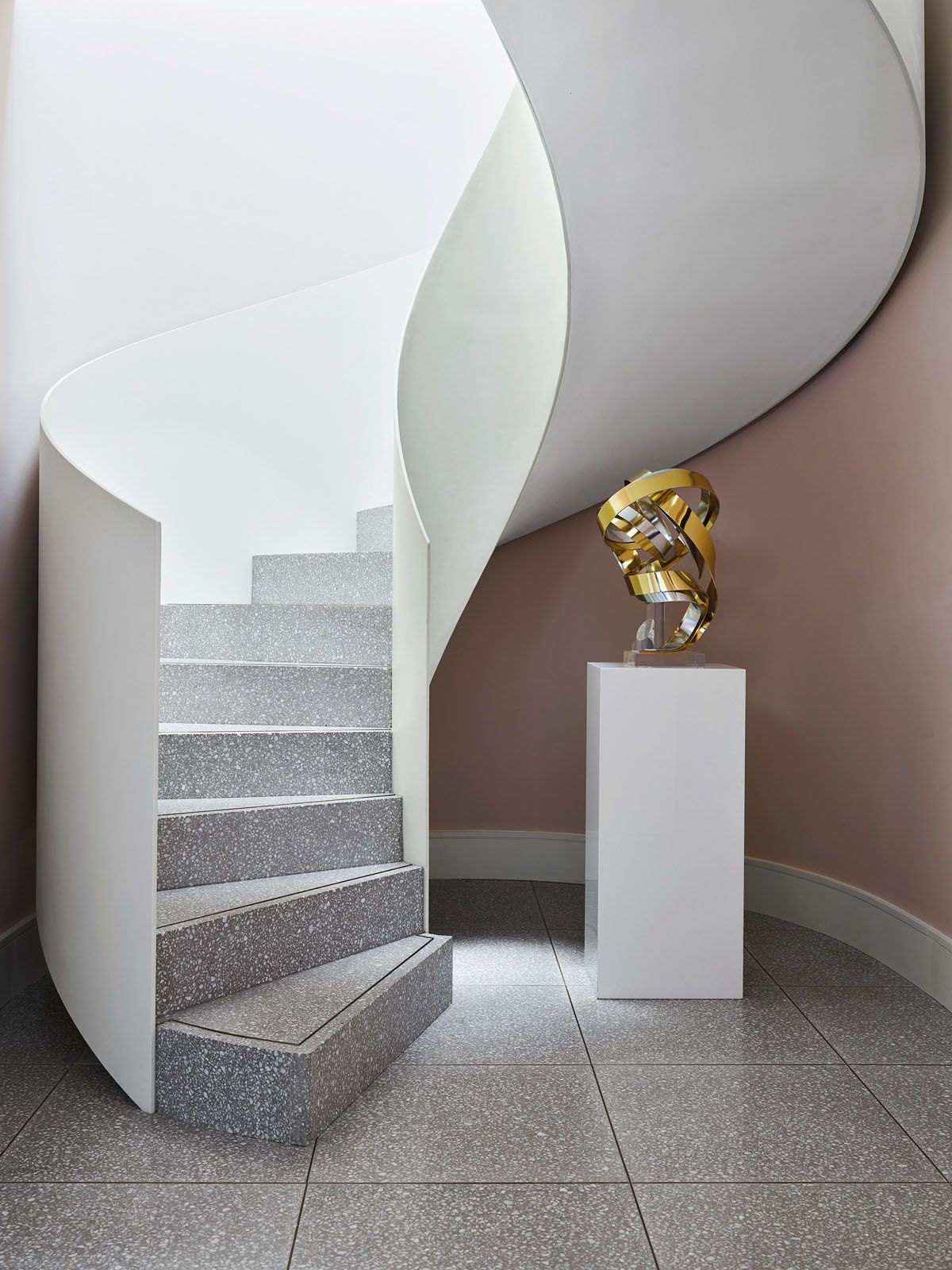 An abstract sculpture adds visual interest to the stairwell