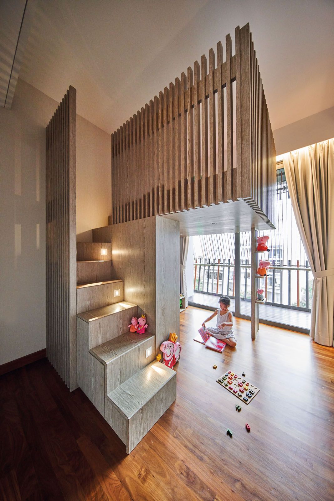 The daughter’s room features an architectural bunk bed; visible from the hallway, the onyx feature wall in the master bedroom also functions as a privacy screen