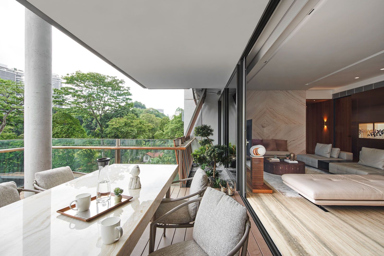 The balcony features an onyx dining table with built-in lighting;