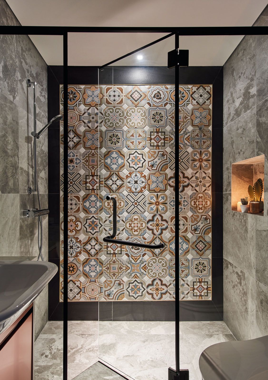 Peranakan-style tiles add a touch of whimsy to this bathroom