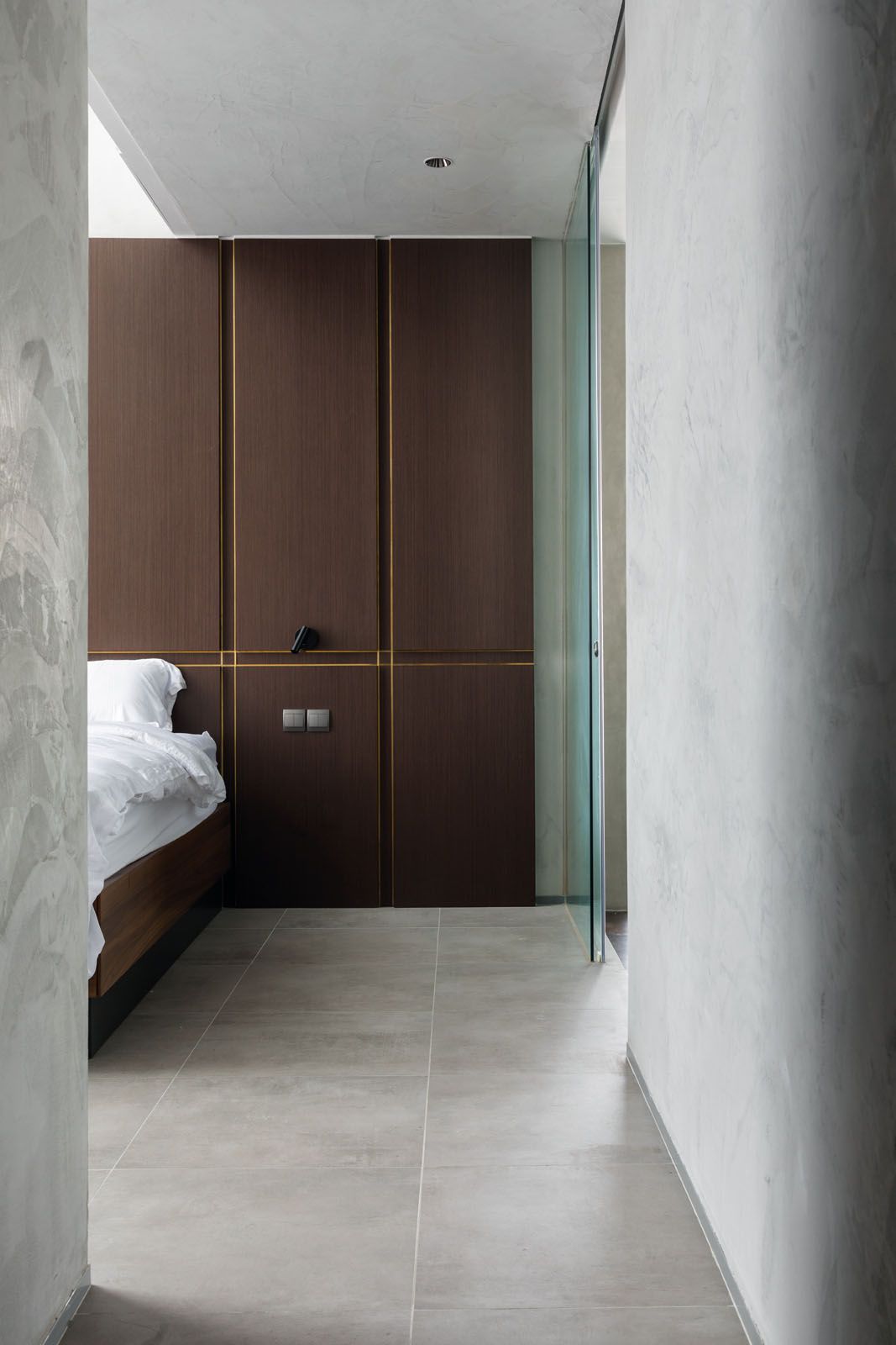 The master bedroom does away with ornamental distractions to facilitate a restful slumber