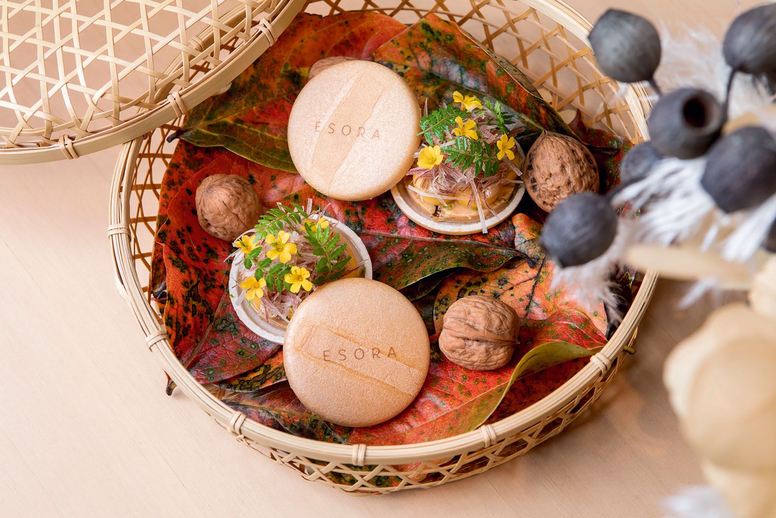 Savoury monaka filled with foie gras torchon, roasted nuts, lime zest and seasonal fruits