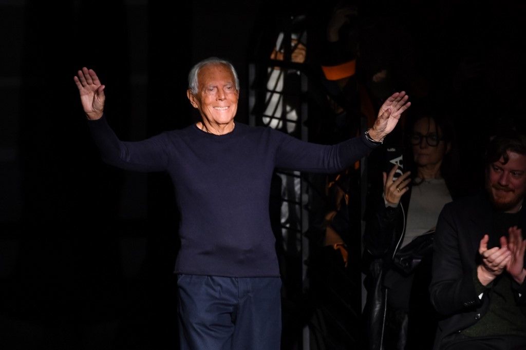 Italian fashion designer Giorgio Armani acknowledges applause following the presentation of Emporio Armani's Women Fall - Winter 2020 fashion collection on February 21, 2020 in Milan. (Photo by Andreas SOLARO / AFP)