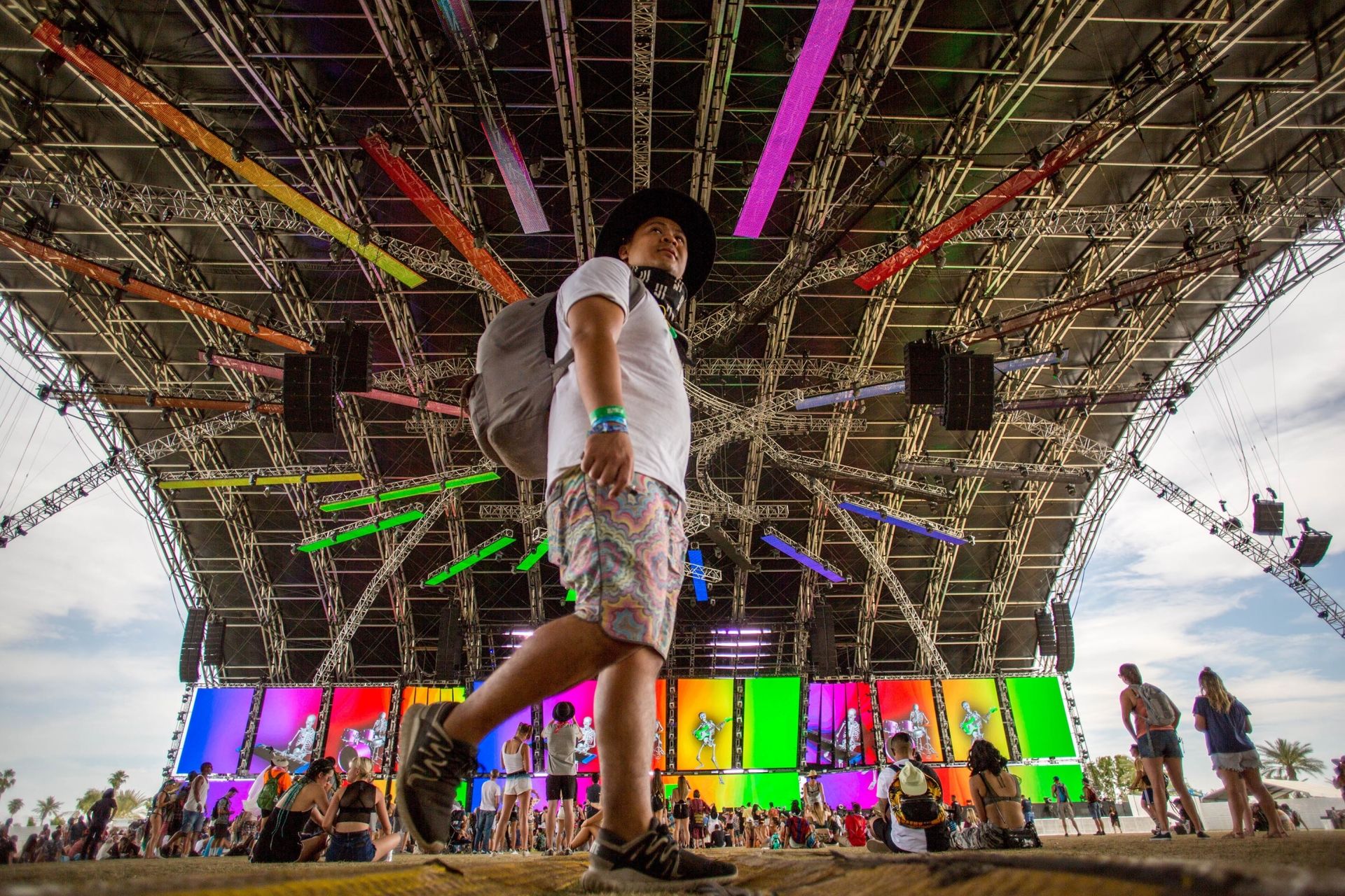 (FILES) In this file photo taken on April 15, 2018 fans in the Sahara Tent look on during the Giraffage performance at the Coachella Music and Arts Festival in Indio, California. - Organizers on March 10, 2020 rescheduled the Coachella music festival until October over coronavirus concerns, following advice from local health authorities. "While this decision comes at a time of universal uncertainty, we take the safety and health of our guests, staff and community very seriously," Goldenvoice, the company th