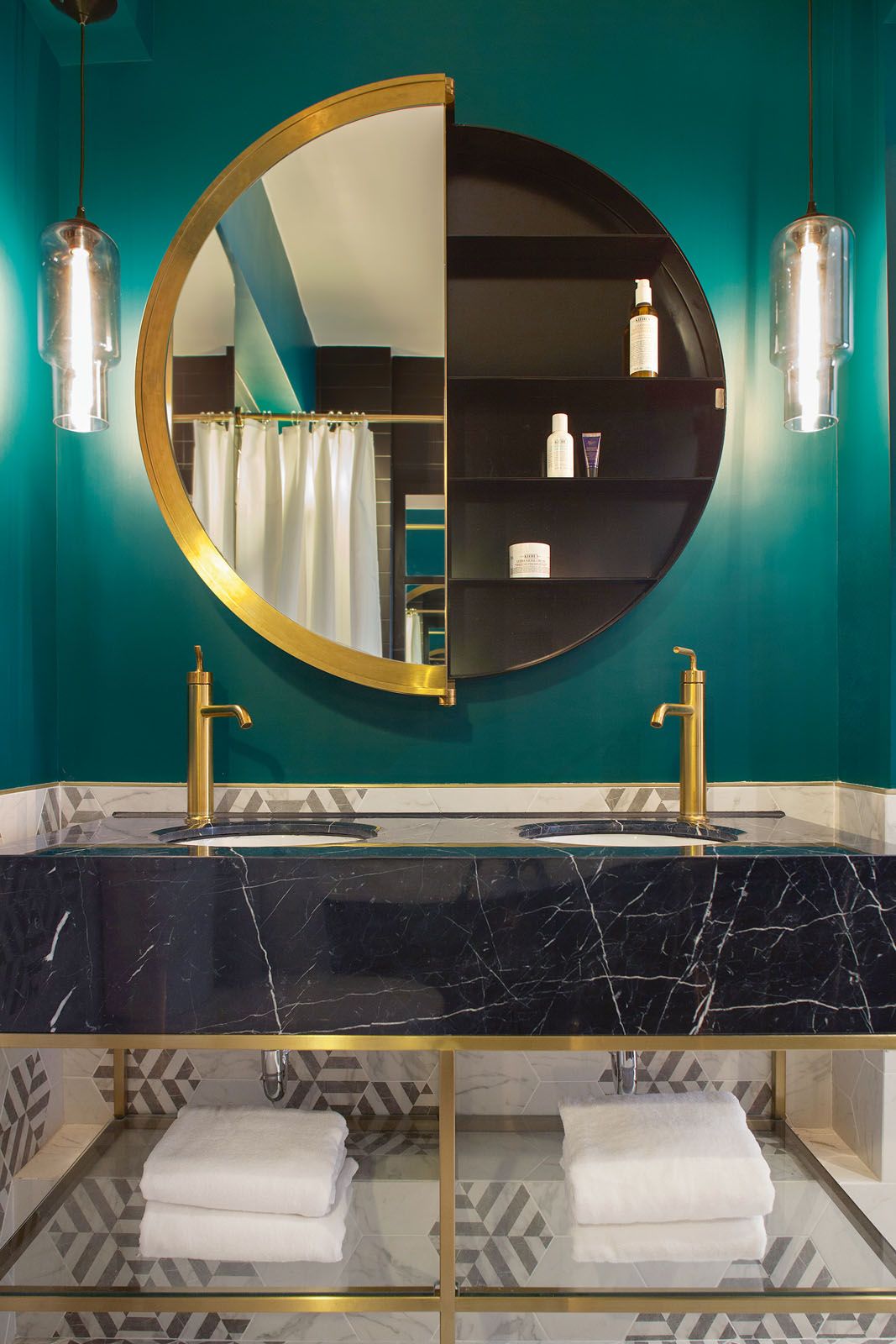 The vanity area of a bathroom in a residential project by Lim + Lu