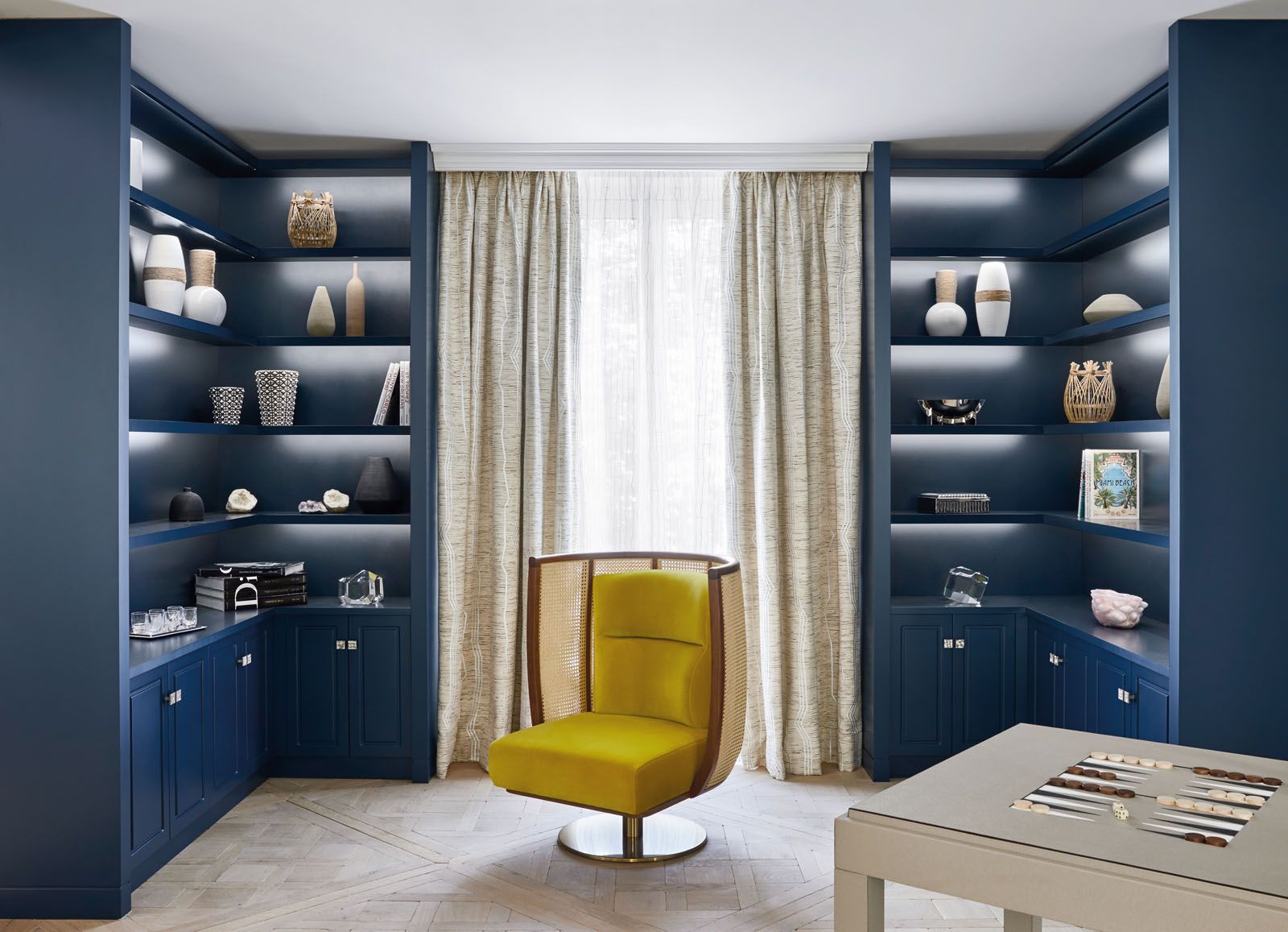Blue cabinetry adds to the sense of tranquility in the secondary living area