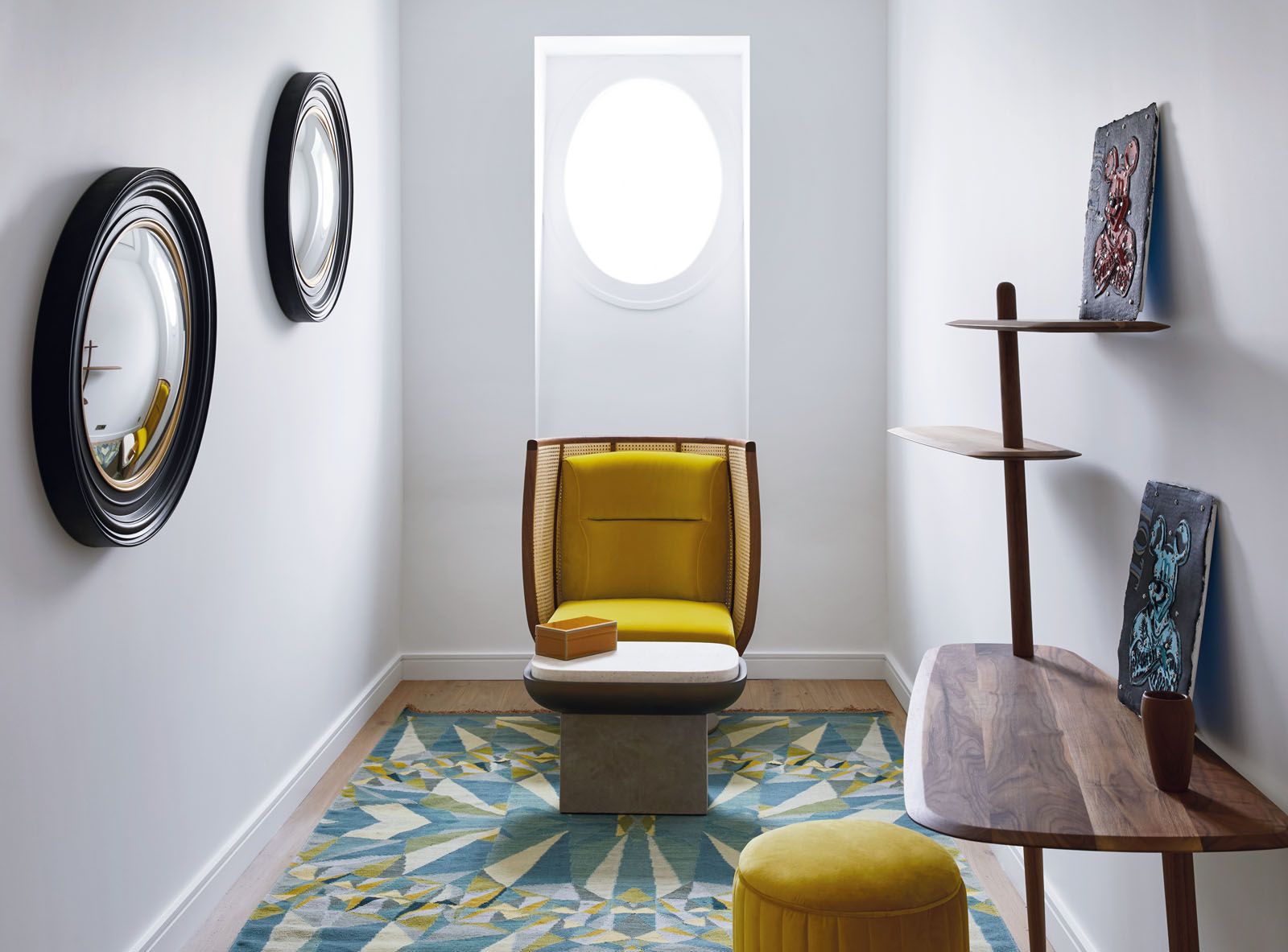 The Dooq armchair and a geometric throw from DAC Rugs liven up this cosy alcove