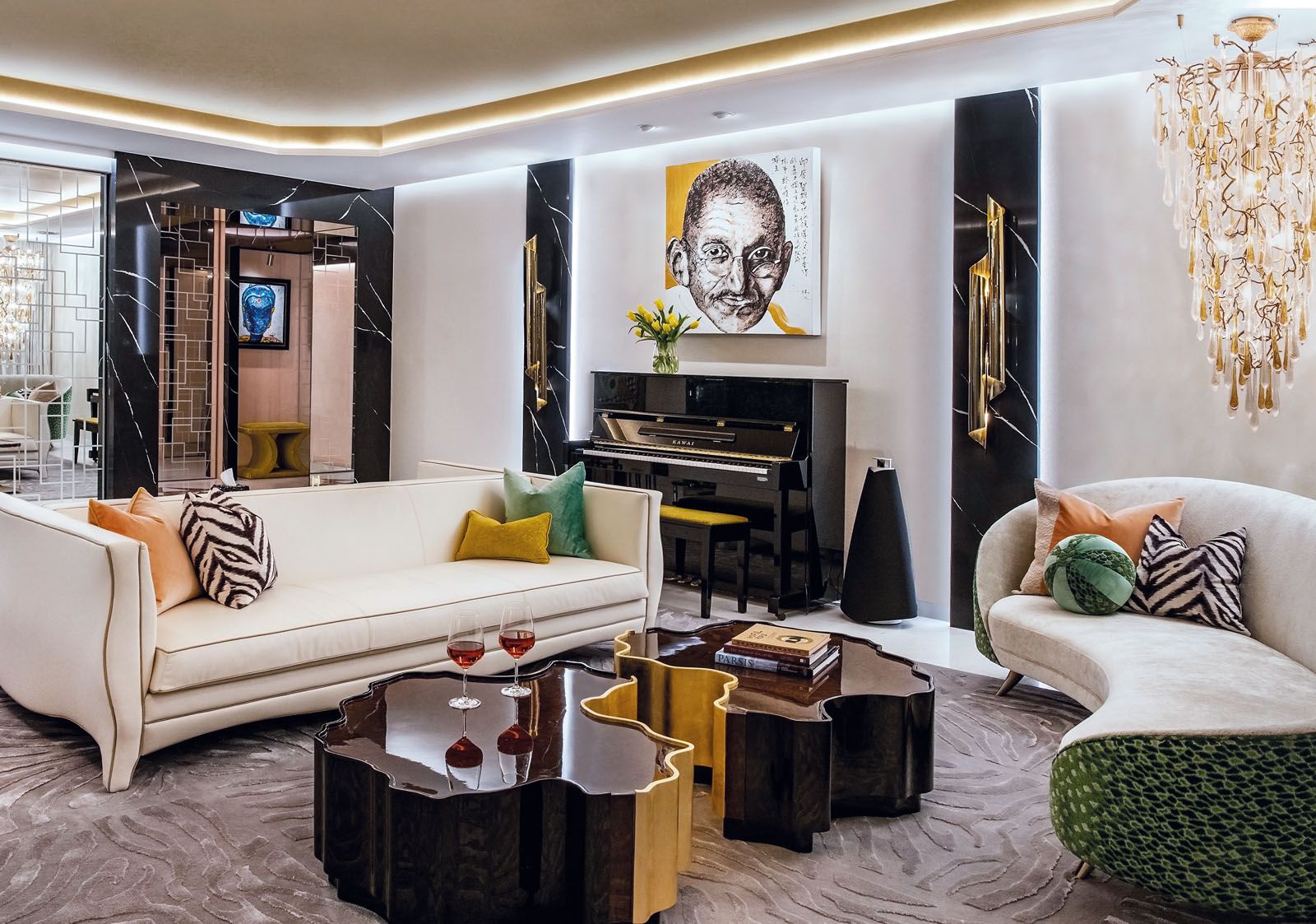 The living area features bespoke furniture by Design Intervention, a Serip chandelier, and a Mahatma Gandhi artwork