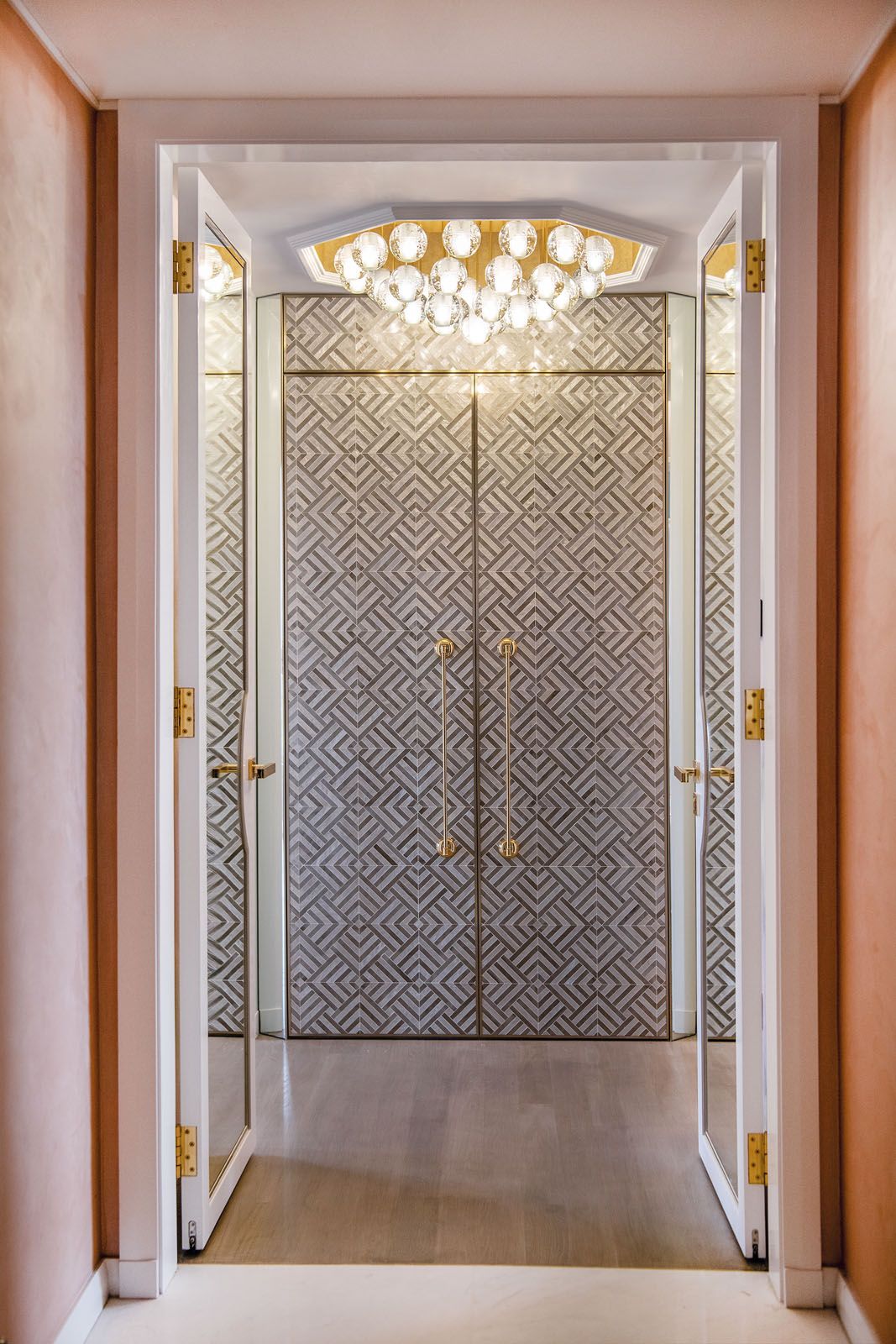 A cluster of Bocci lights makes a statement at the entrance of the master bedroom