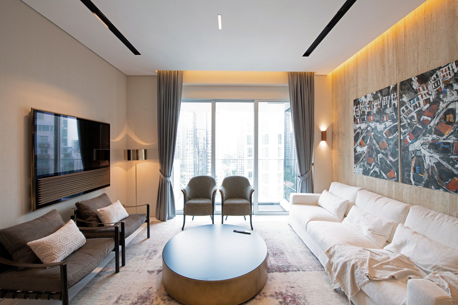 A diptych depicting shophouses by the Singapore River adds a local touch to the living room