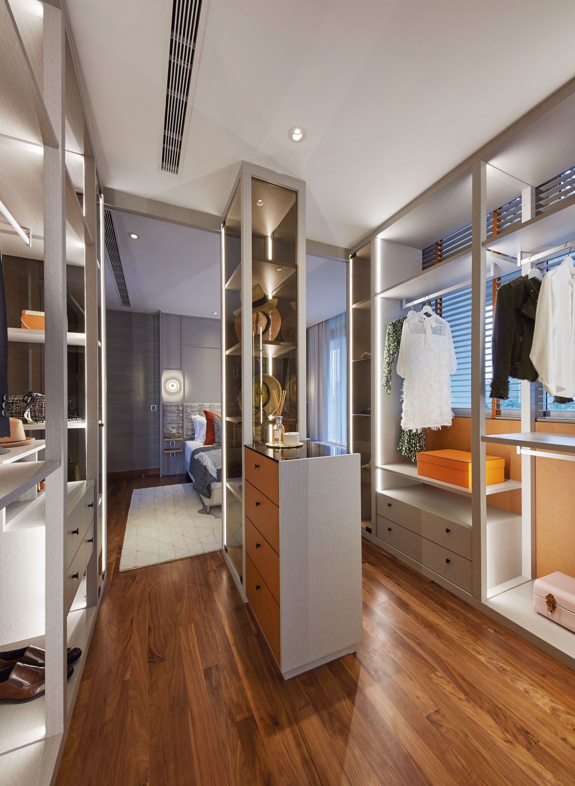 The open-concept look of the wardrobe area is reminiscent of hotel-style suites;