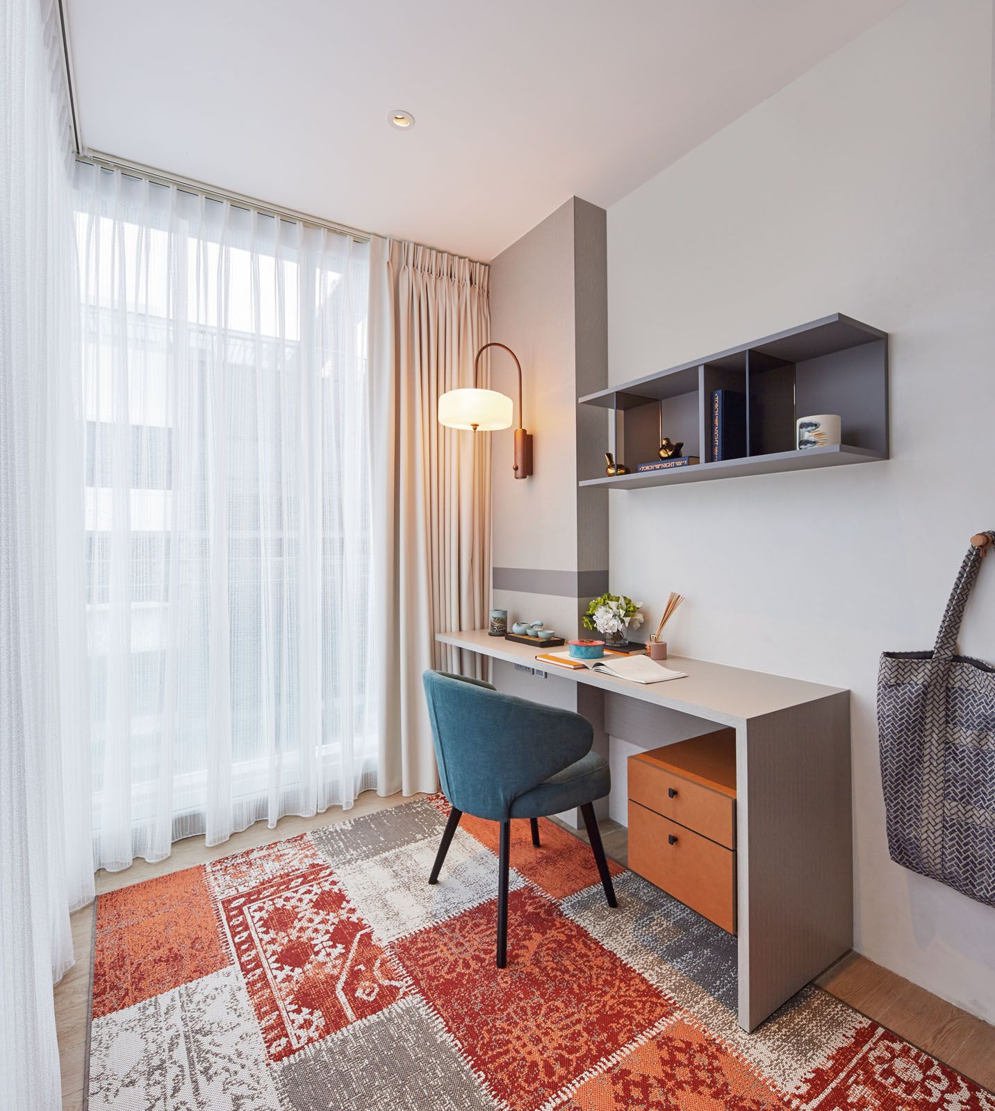 The rug in this study is a beautiful tapestry of patterns