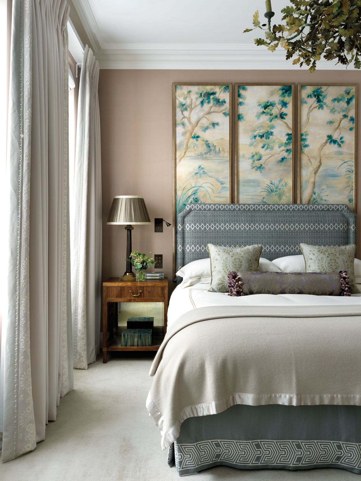 Floral panels by Flora Roberts form a centrepiece in the master bedroom