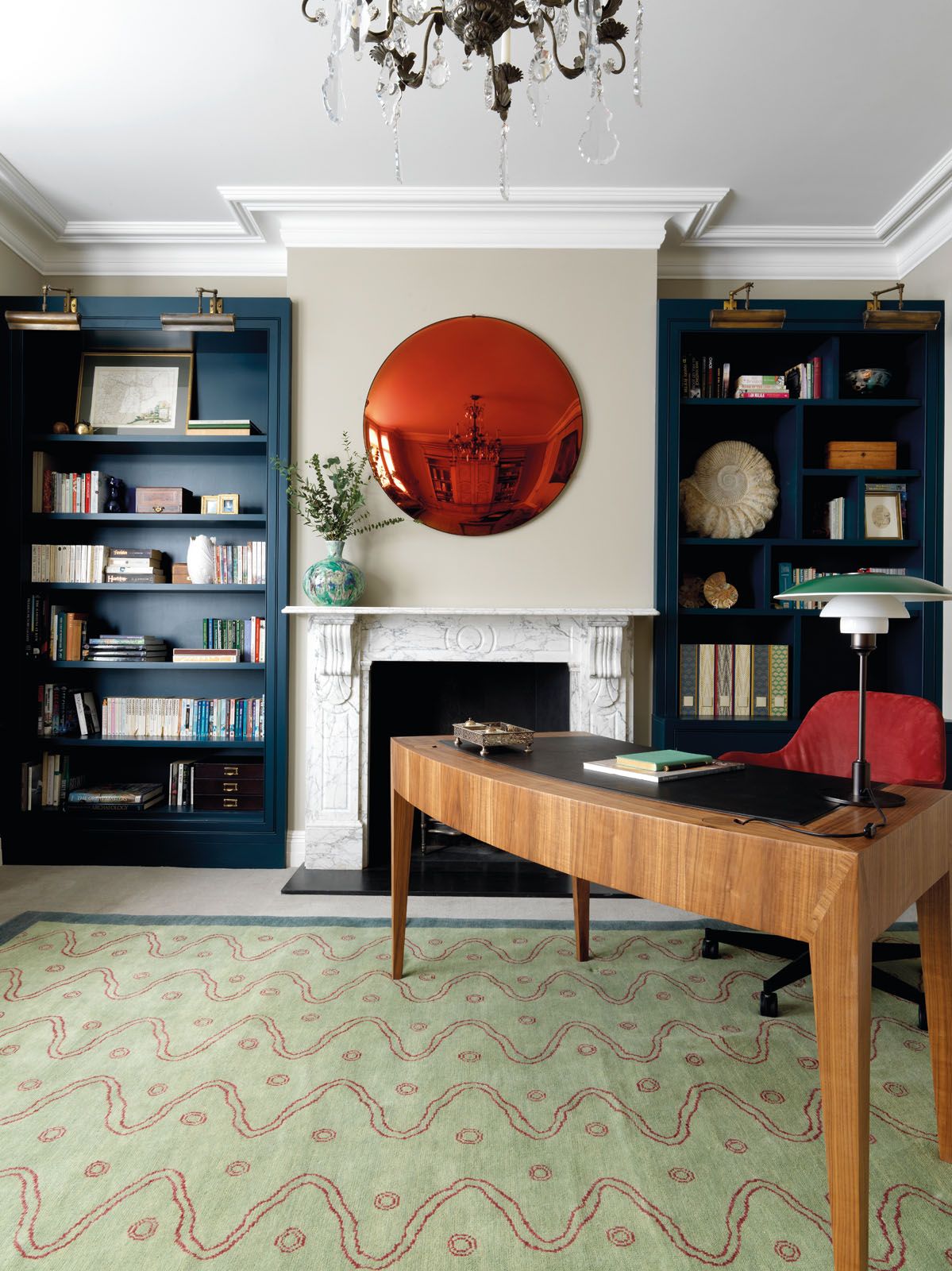 The study features a B&S Glass Industries convex mirror, a rug by Melissa Wyndham and Robert Stephenson and a desk by K&H Design