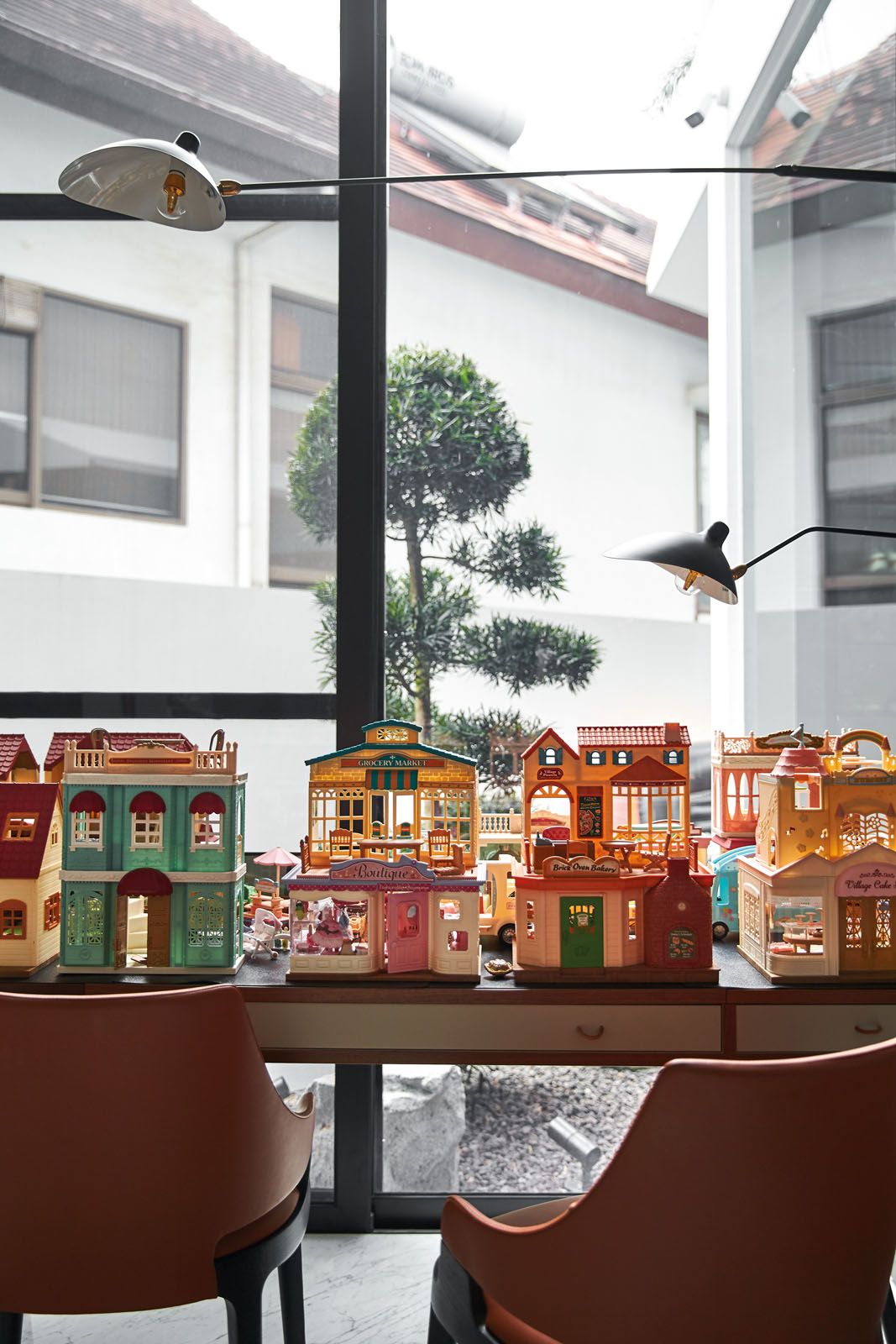 Located next to the living area, the play room features a collection of dollhouses