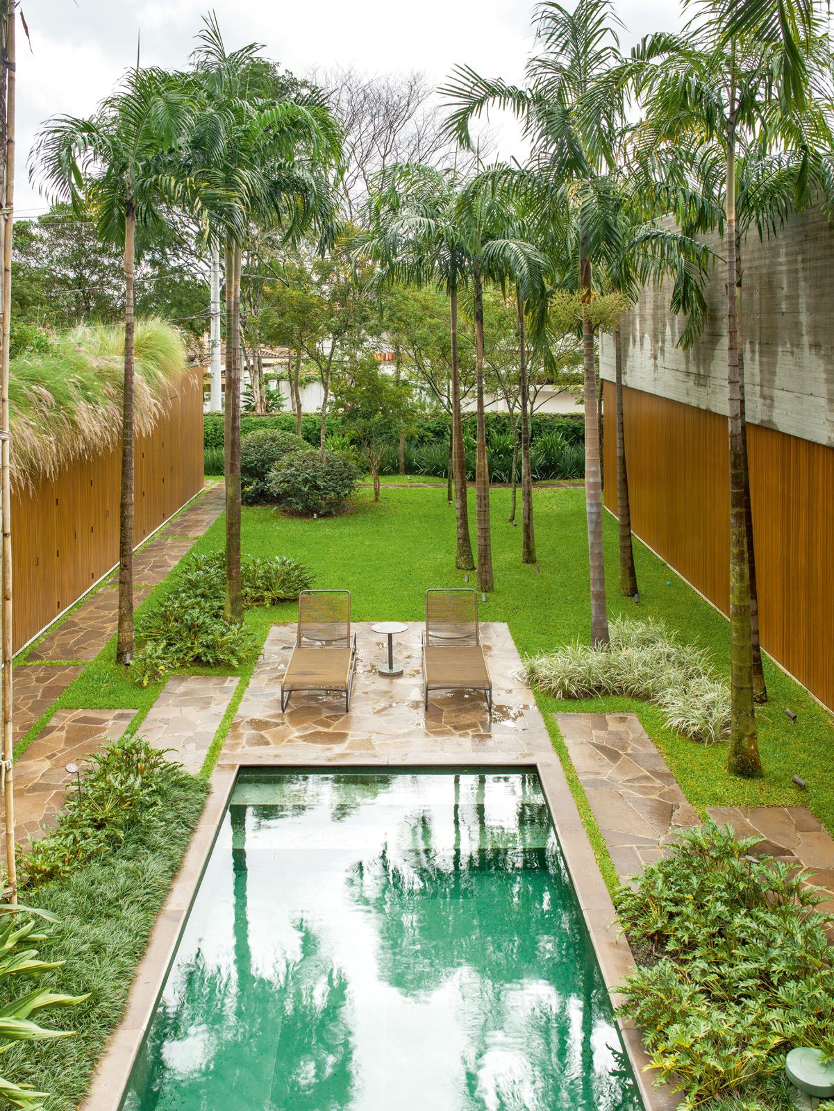 The flourishing greenery contributes to the calming scene at the pool deck