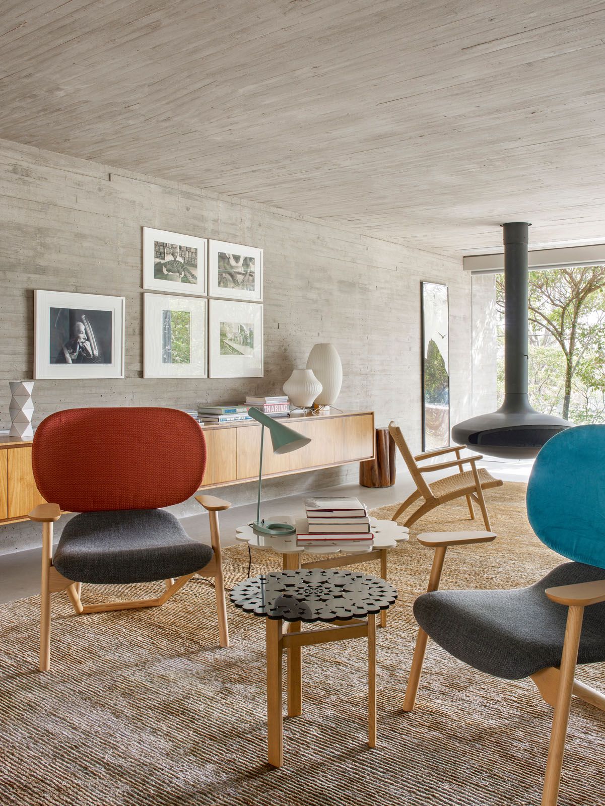 This section of the living area features a sideboard by Studio MK27, table lamps by George Nelson and a pair of Moroso Klara armchairs by Patricia Urquiola
